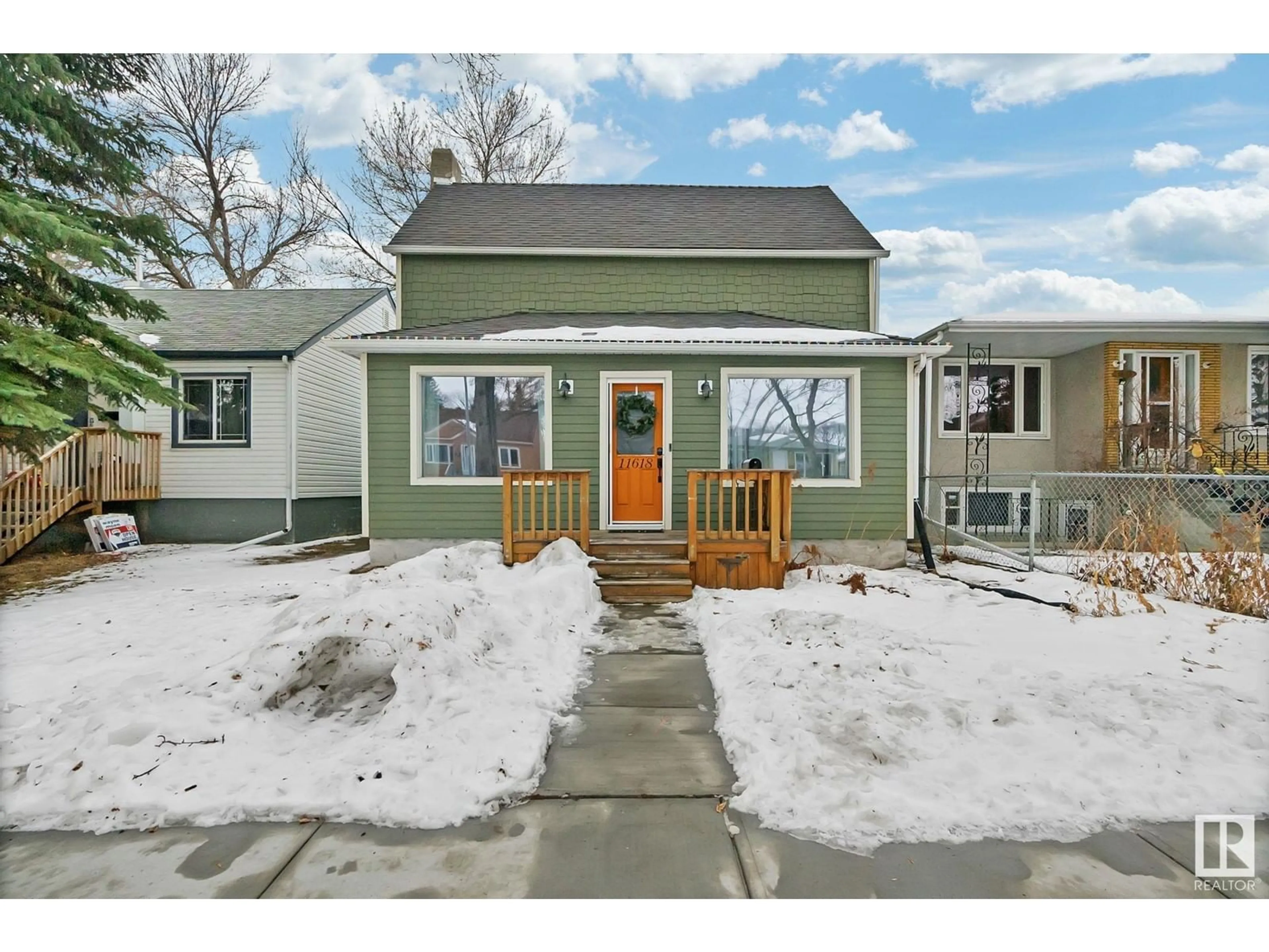 Home with vinyl exterior material, street for 11618 91 ST NW, Edmonton Alberta T5B4B1