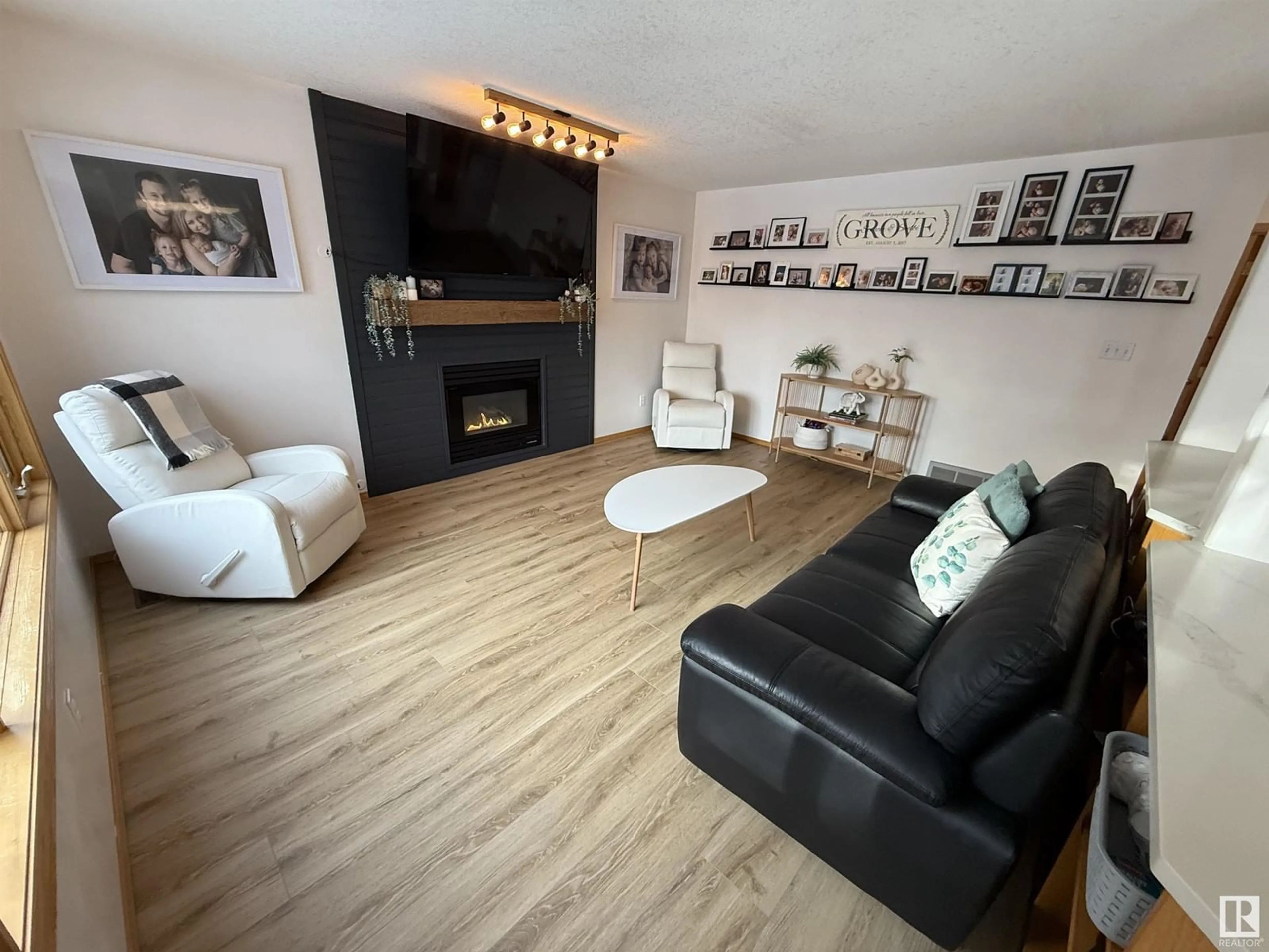 Living room with furniture, wood/laminate floor for 1507 WELLWOOD WY NW, Edmonton Alberta T6M2M3