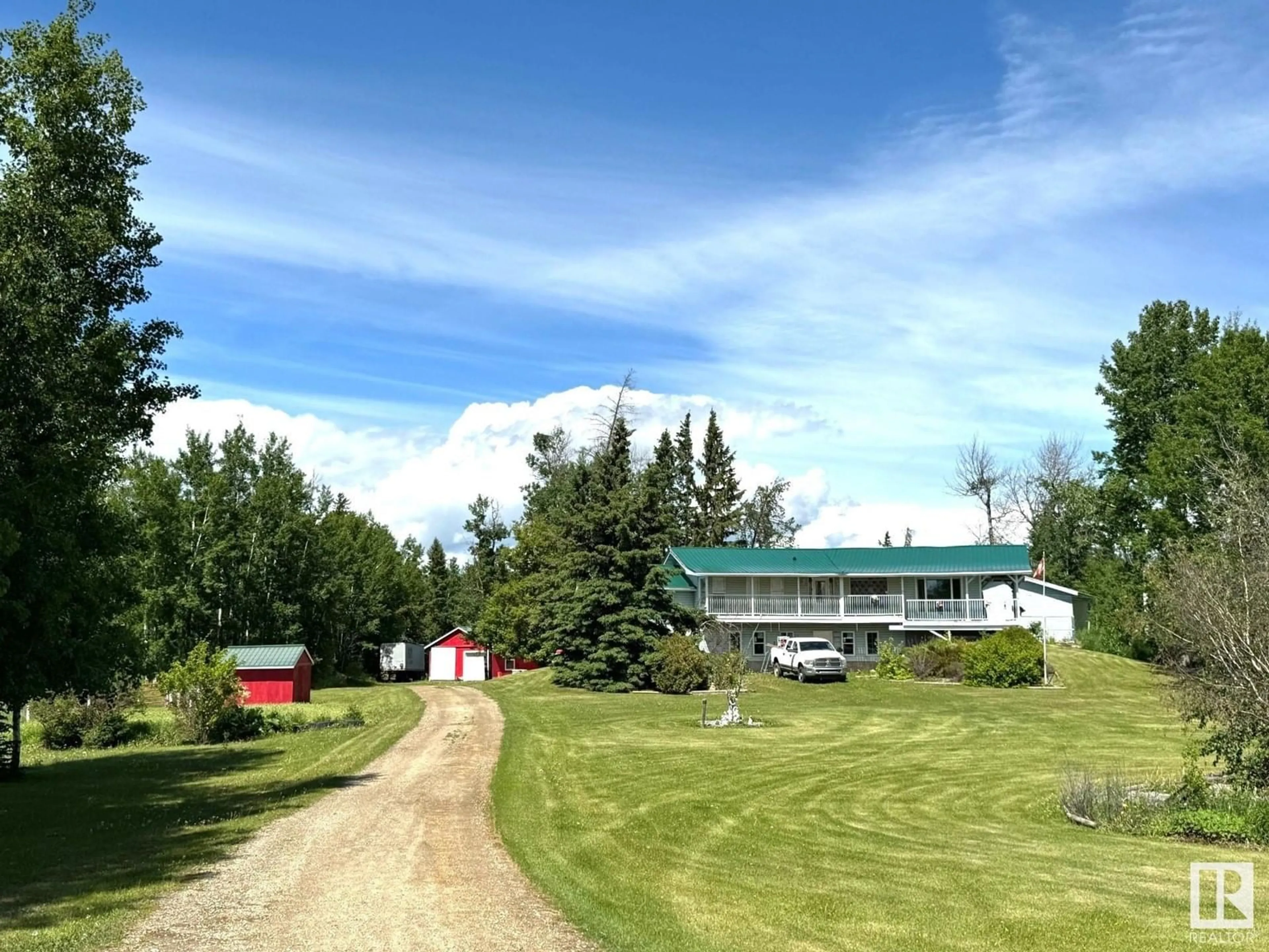 A pic from outside/outdoor area/front of a property/back of a property/a pic from drone, mountain view for 5230 TWP 510, Rural Parkland County Alberta T0E2H0