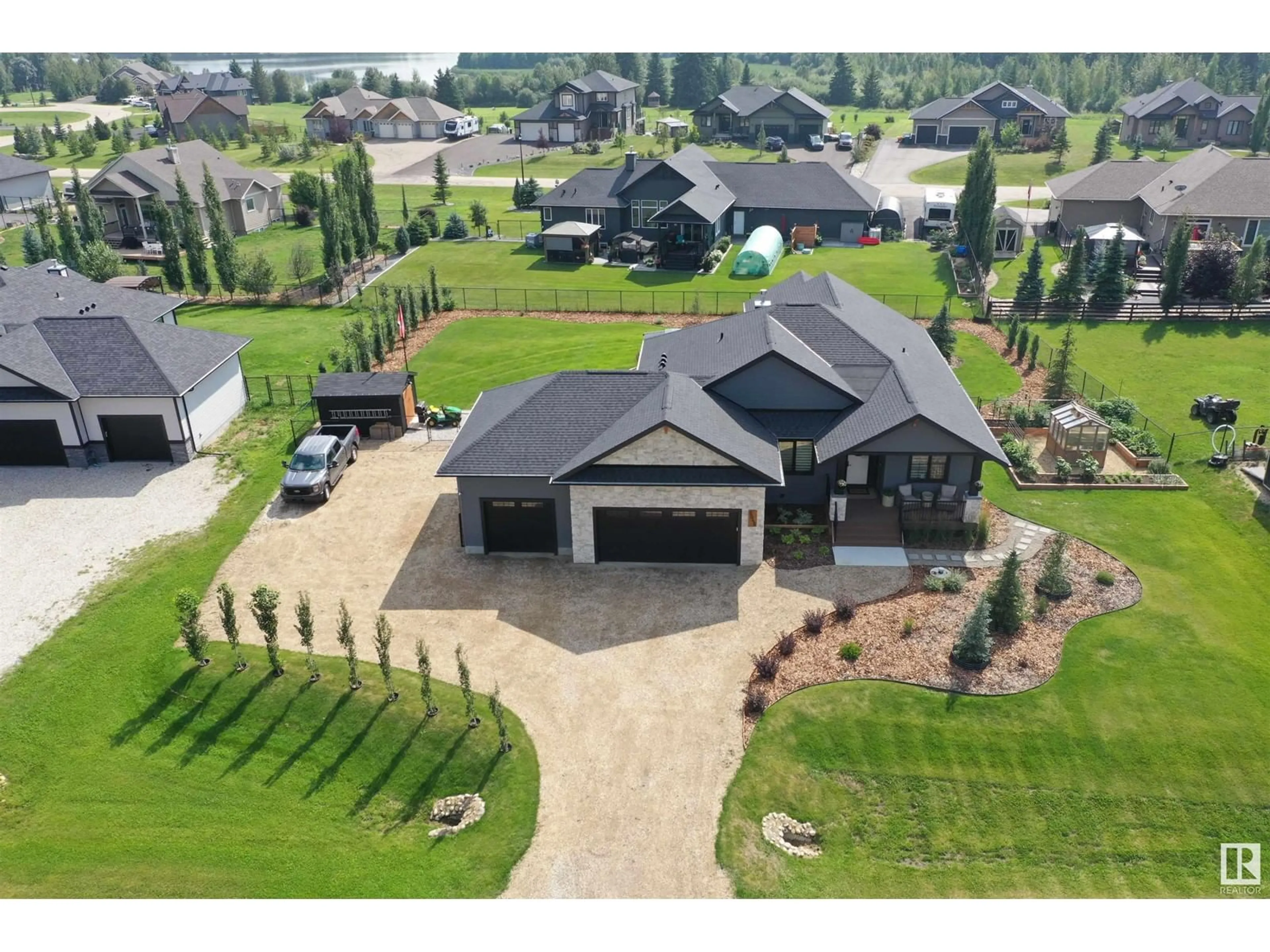 A pic from outside/outdoor area/front of a property/back of a property/a pic from drone, unknown for 2045 SPRUCE CR, Rural Parkland County Alberta T7Z0G8