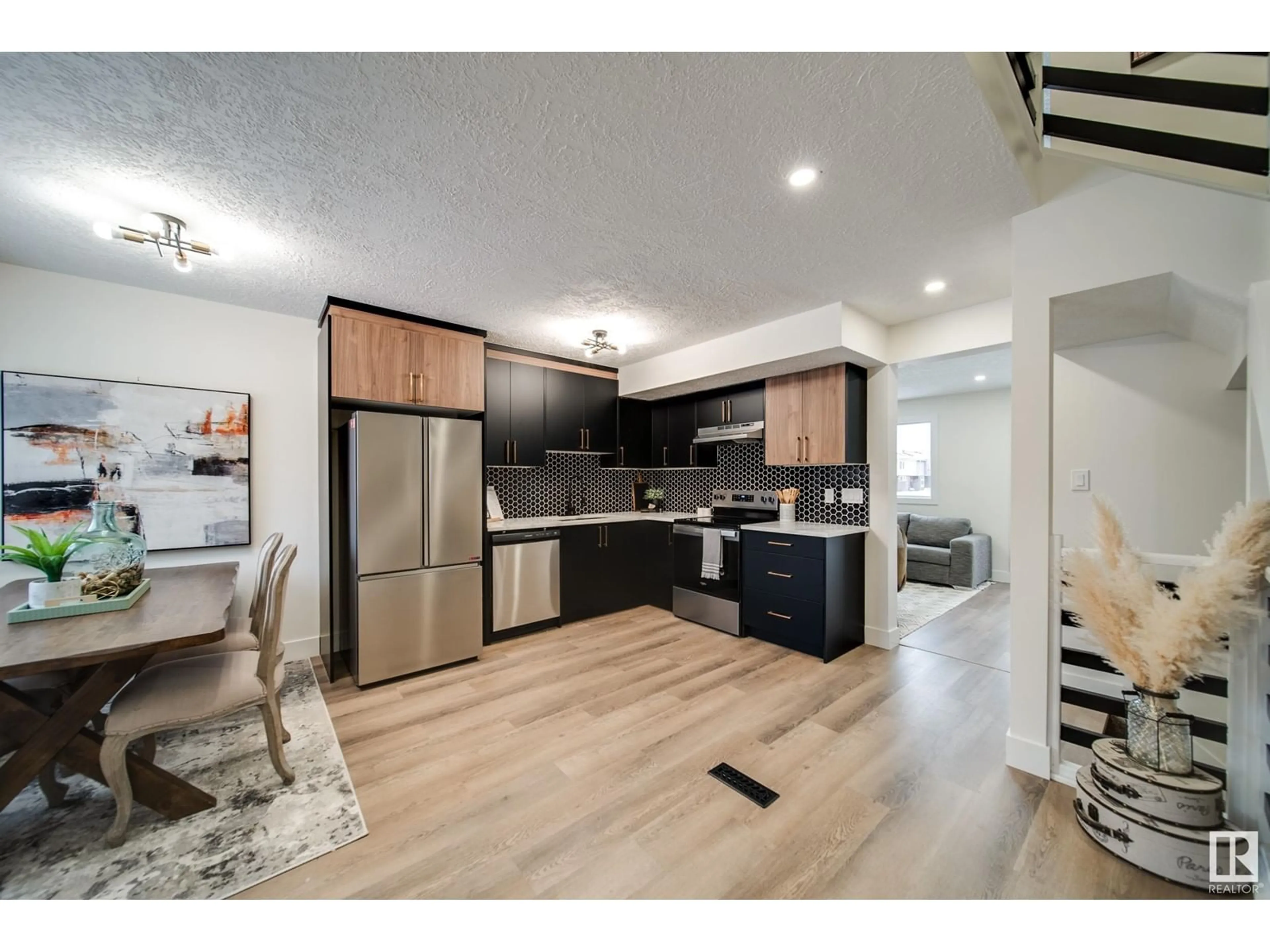 Open concept kitchen, wood/laminate floor for 1145 HOOKE RD NW, Edmonton Alberta T5A4A5