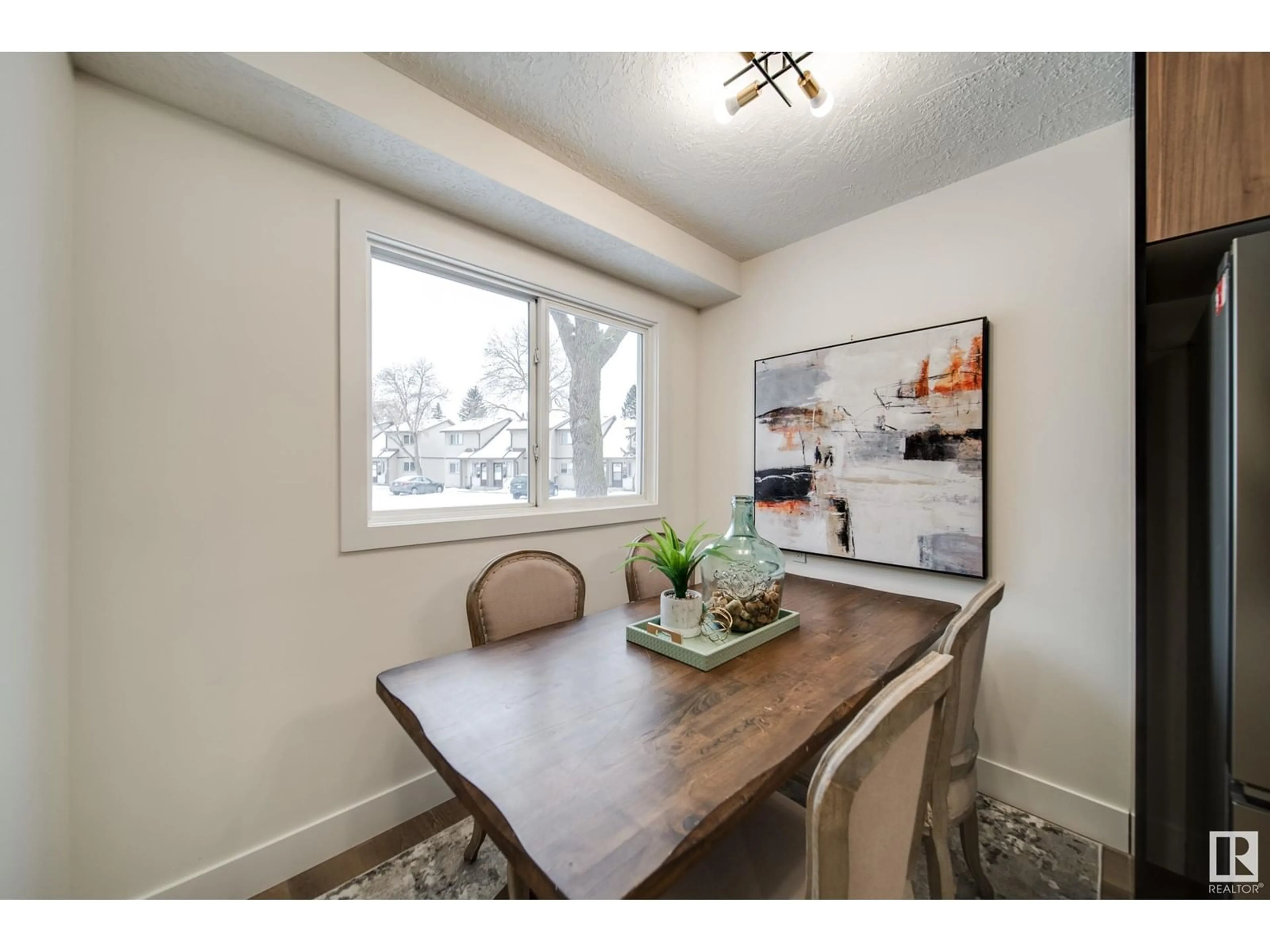 Dining room, wood/laminate floor for 1145 HOOKE RD NW, Edmonton Alberta T5A4A5