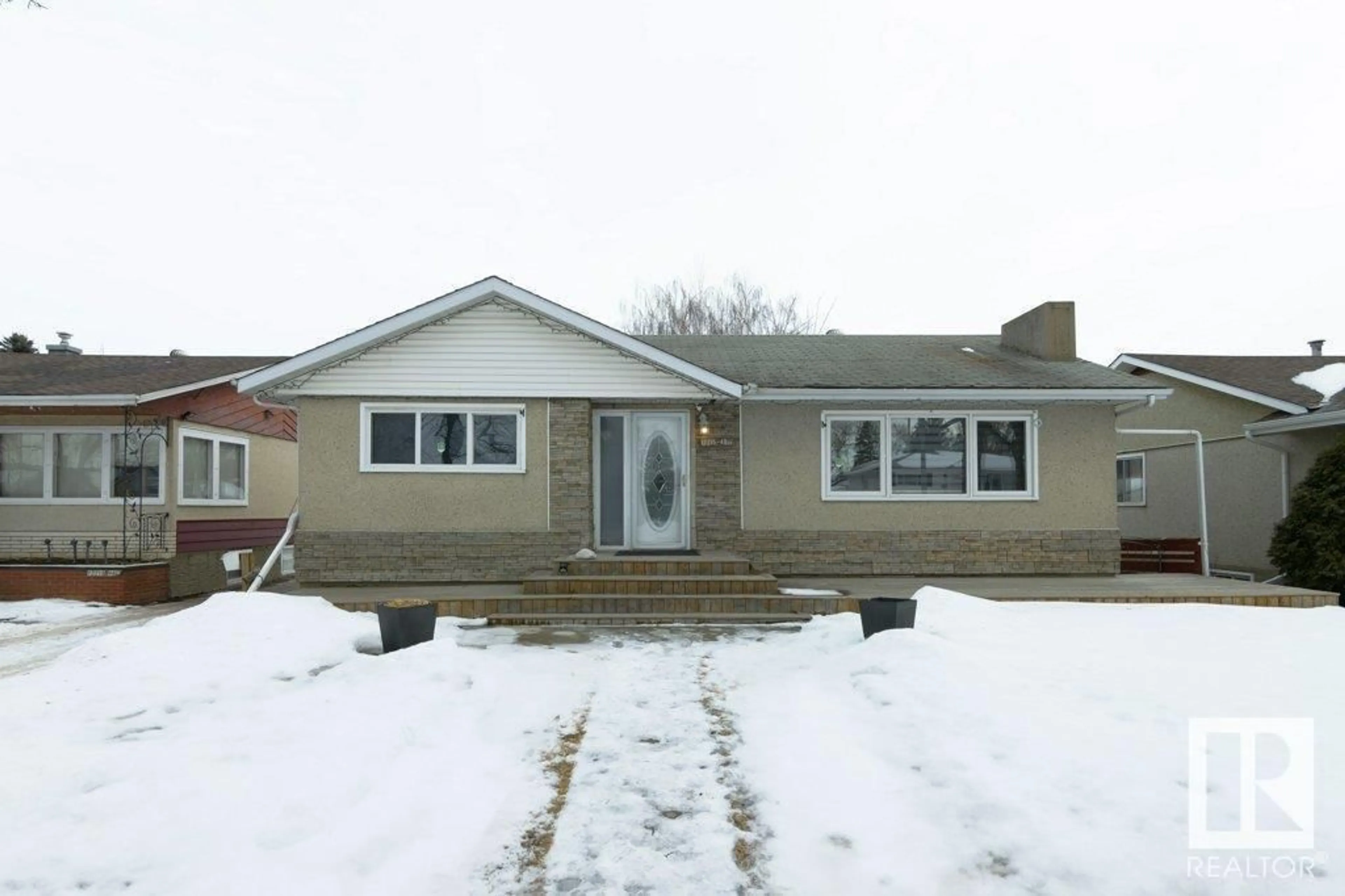 Home with vinyl exterior material, street for 12215 48 ST NW, Edmonton Alberta T5W2Z3