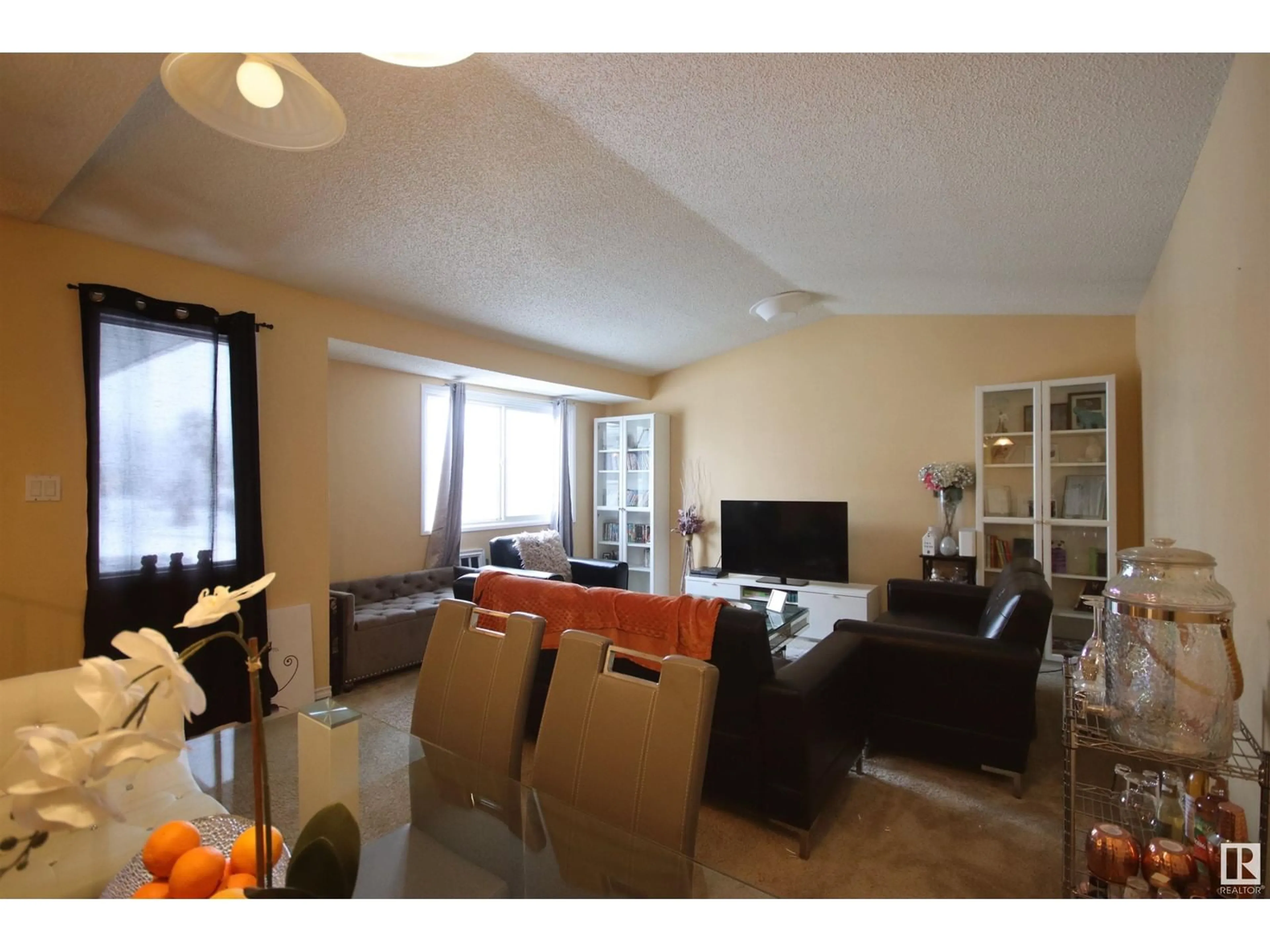 Living room with furniture, wood/laminate floor for 632 WILLOW CO NW, Edmonton Alberta T5T2K7