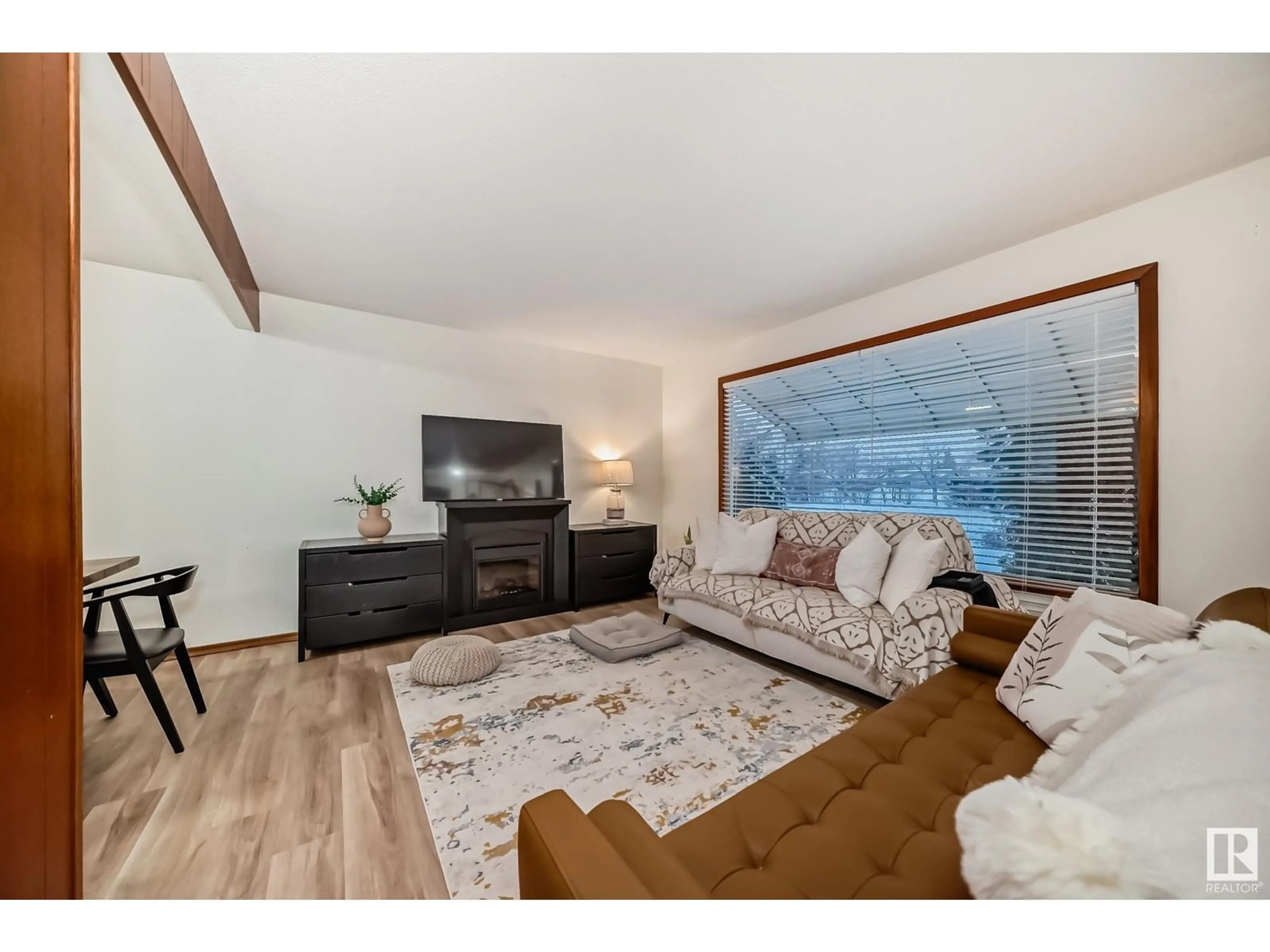 Living room with furniture, wood/laminate floor for 13315 95 ST NW, Edmonton Alberta T5E3Y3