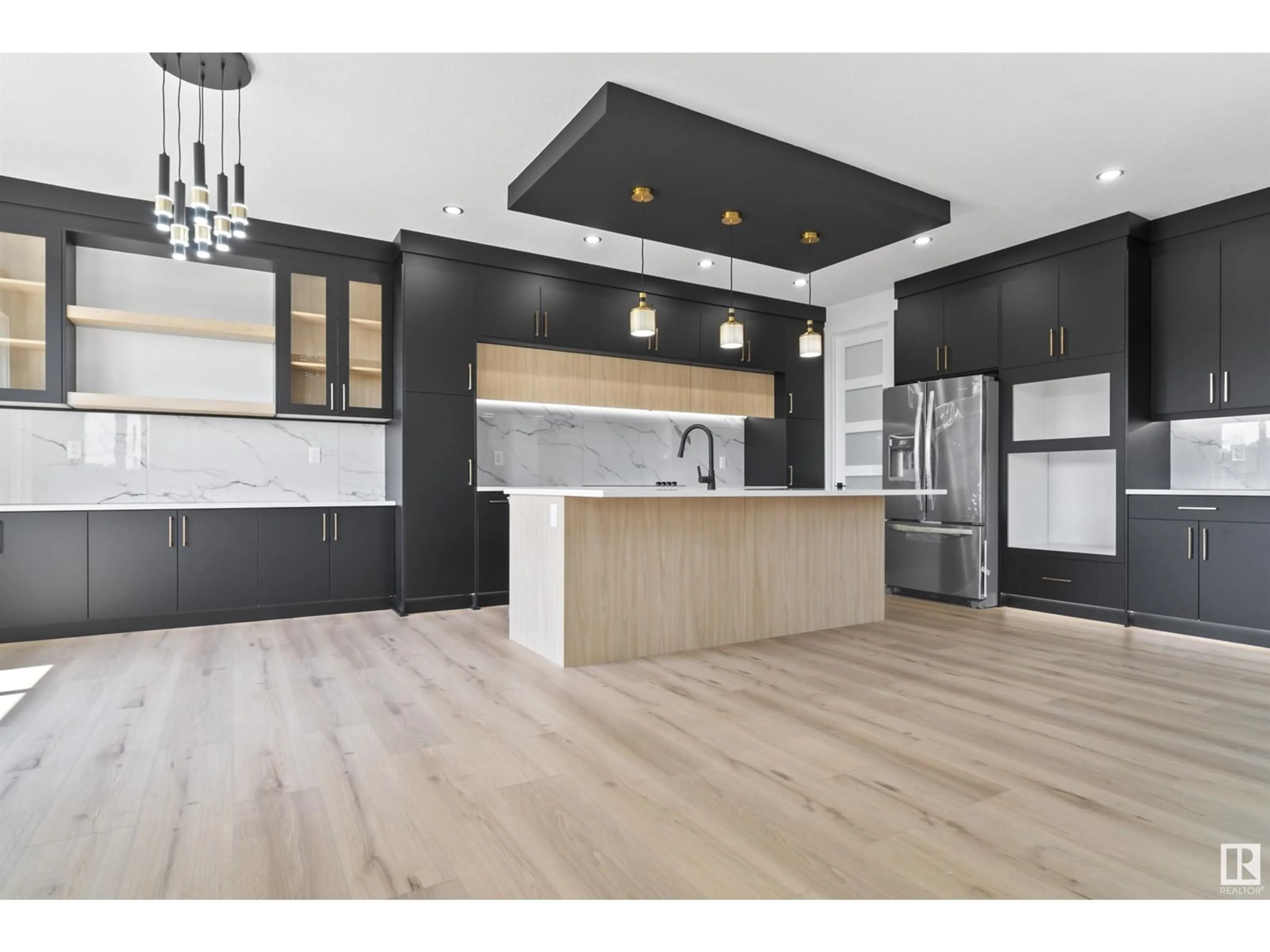 Open concept kitchen, wood/laminate floor for 124 EDGEWATER CI, Leduc Alberta T9E1K5