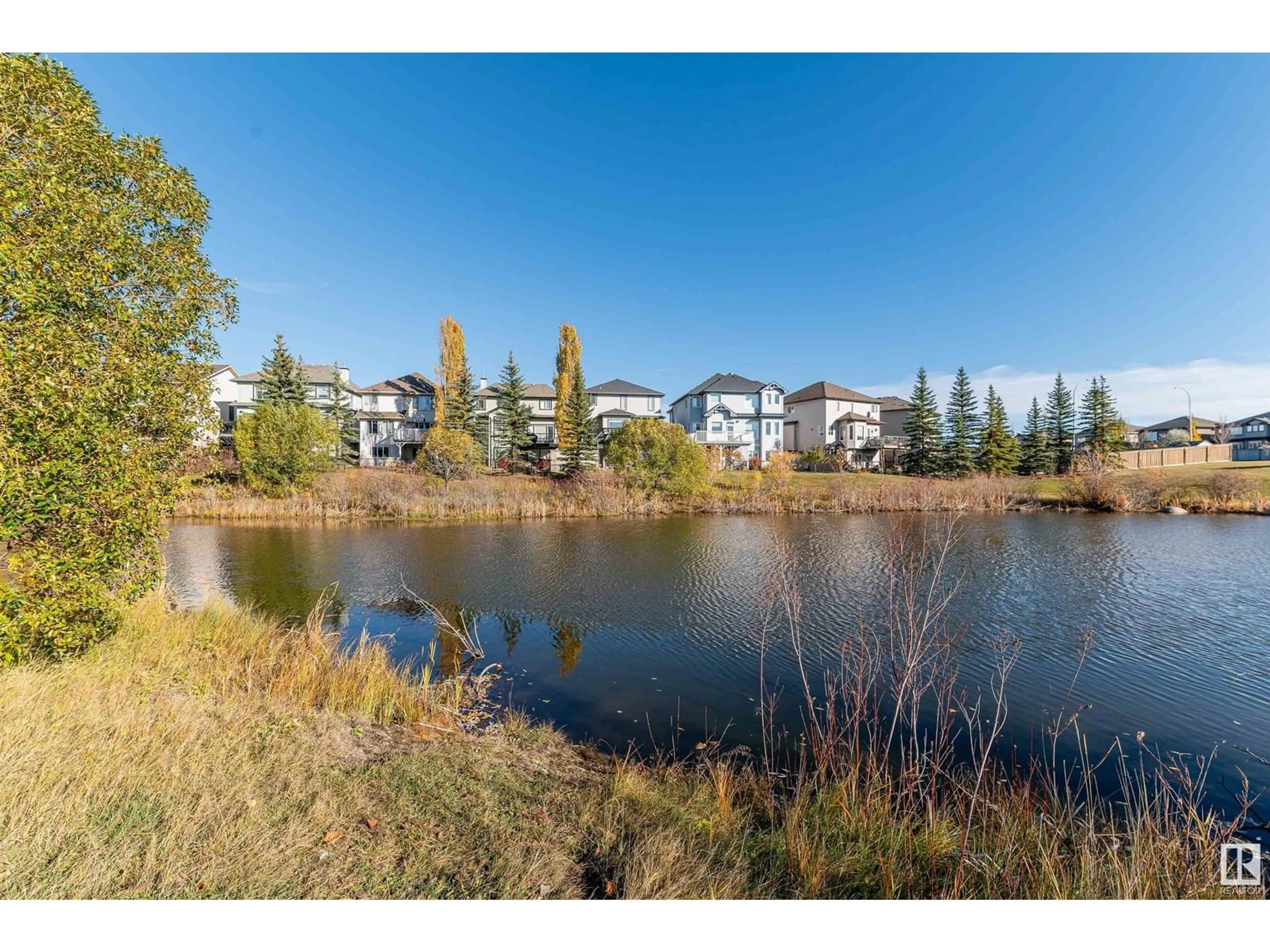 A pic from outside/outdoor area/front of a property/back of a property/a pic from drone, water/lake/river/ocean view for #212 7021 SOUTH TERWILLEGAR DR NW, Edmonton Alberta T6R0W5