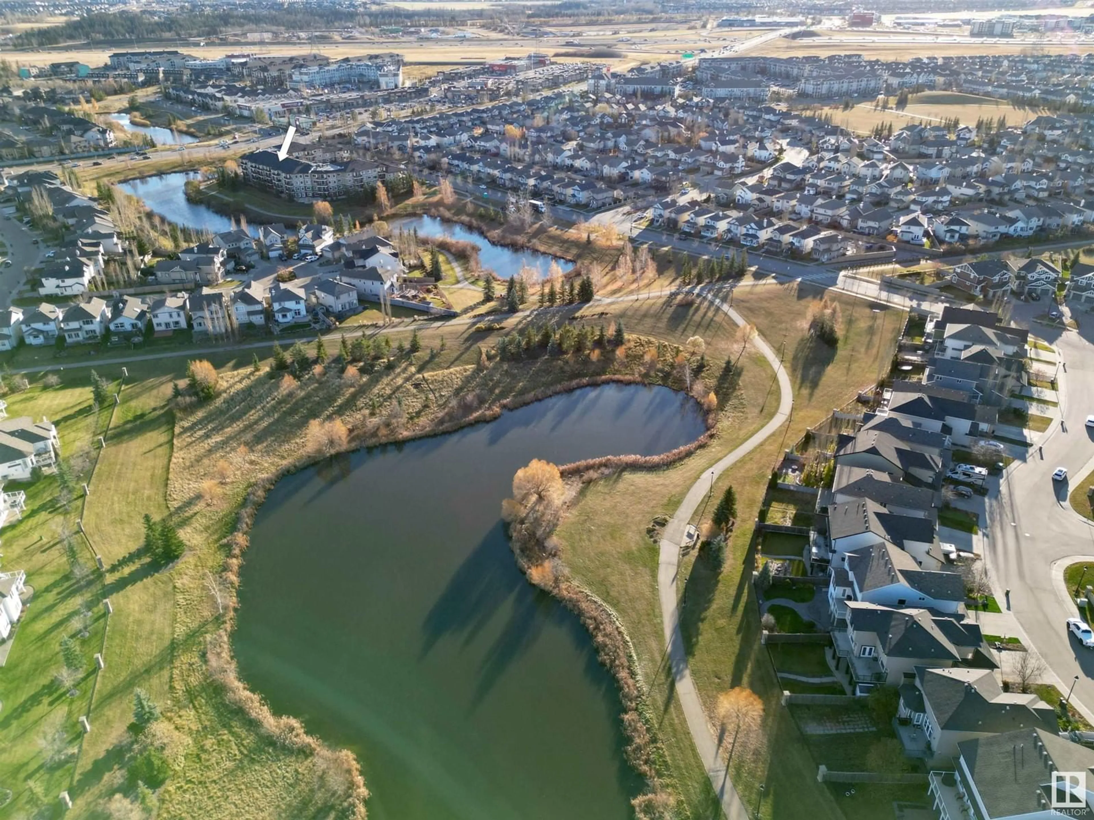 A pic from outside/outdoor area/front of a property/back of a property/a pic from drone, water/lake/river/ocean view for #212 7021 SOUTH TERWILLEGAR DR NW, Edmonton Alberta T6R0W5