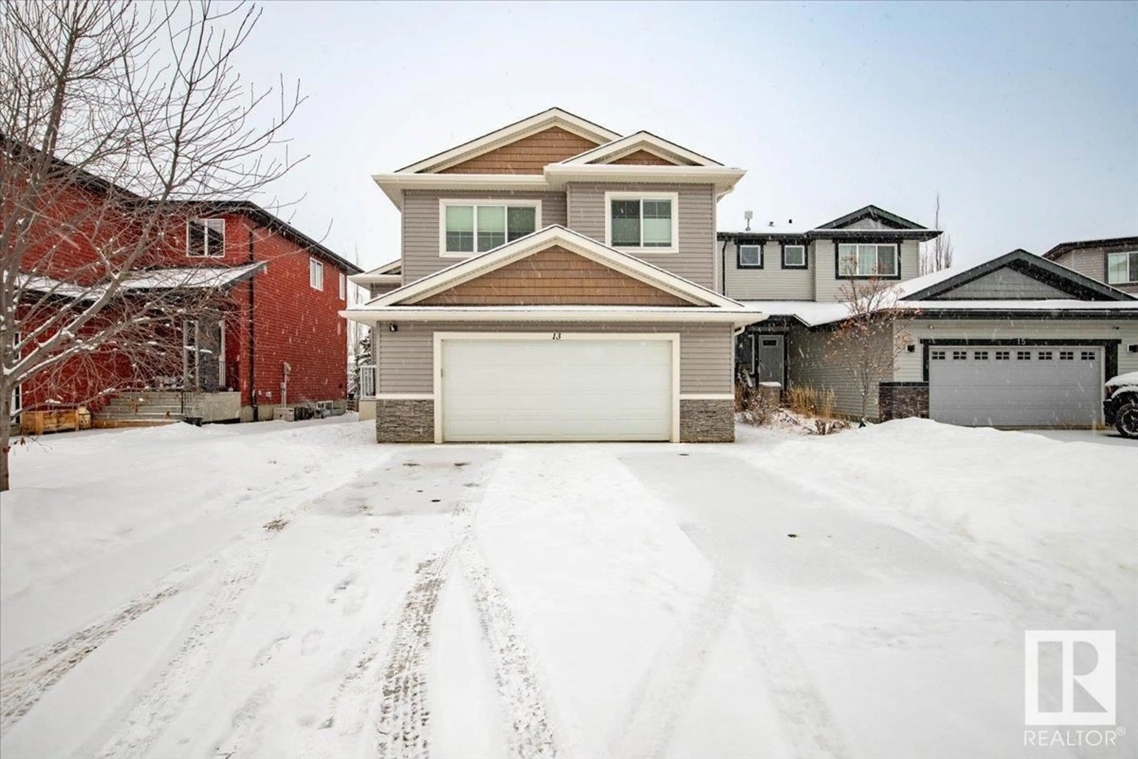 Home with vinyl exterior material, street for 13 Southbridge Cr, Calmar Alberta T0C0V0