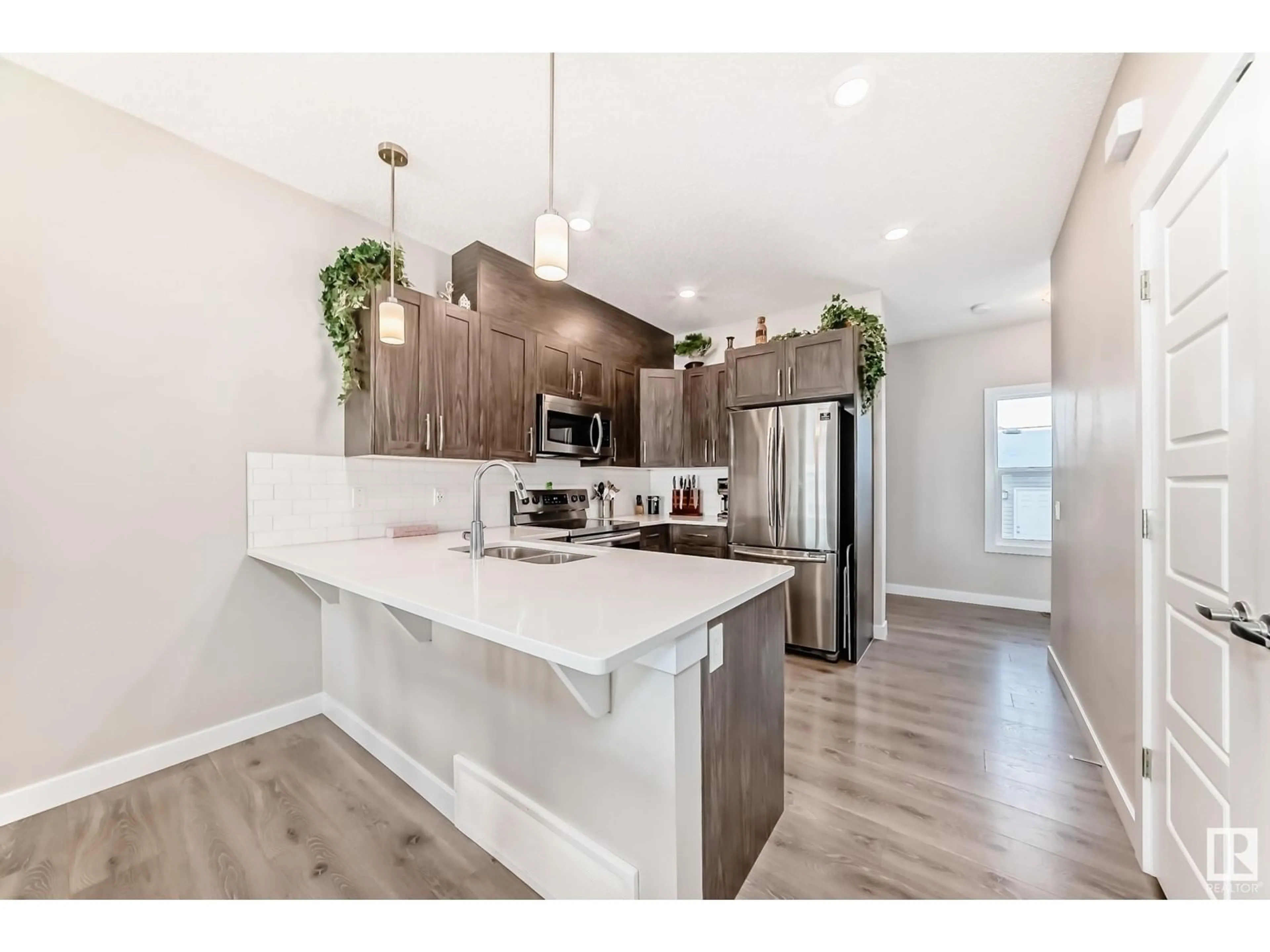 Open concept kitchen, unknown for 4072 Chappelle GR SW, Edmonton Alberta T6W4M7