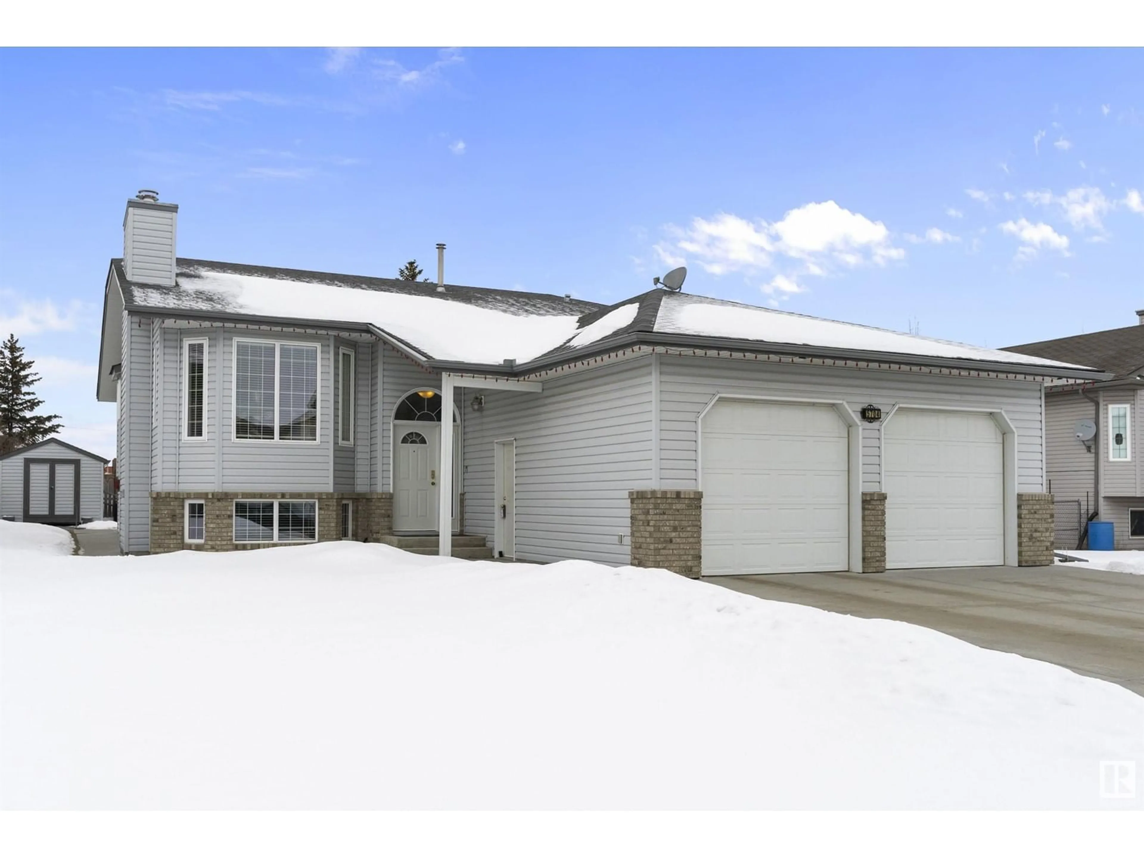 Home with vinyl exterior material, street for 5704 45 ST, Tofield Alberta T0B4J0