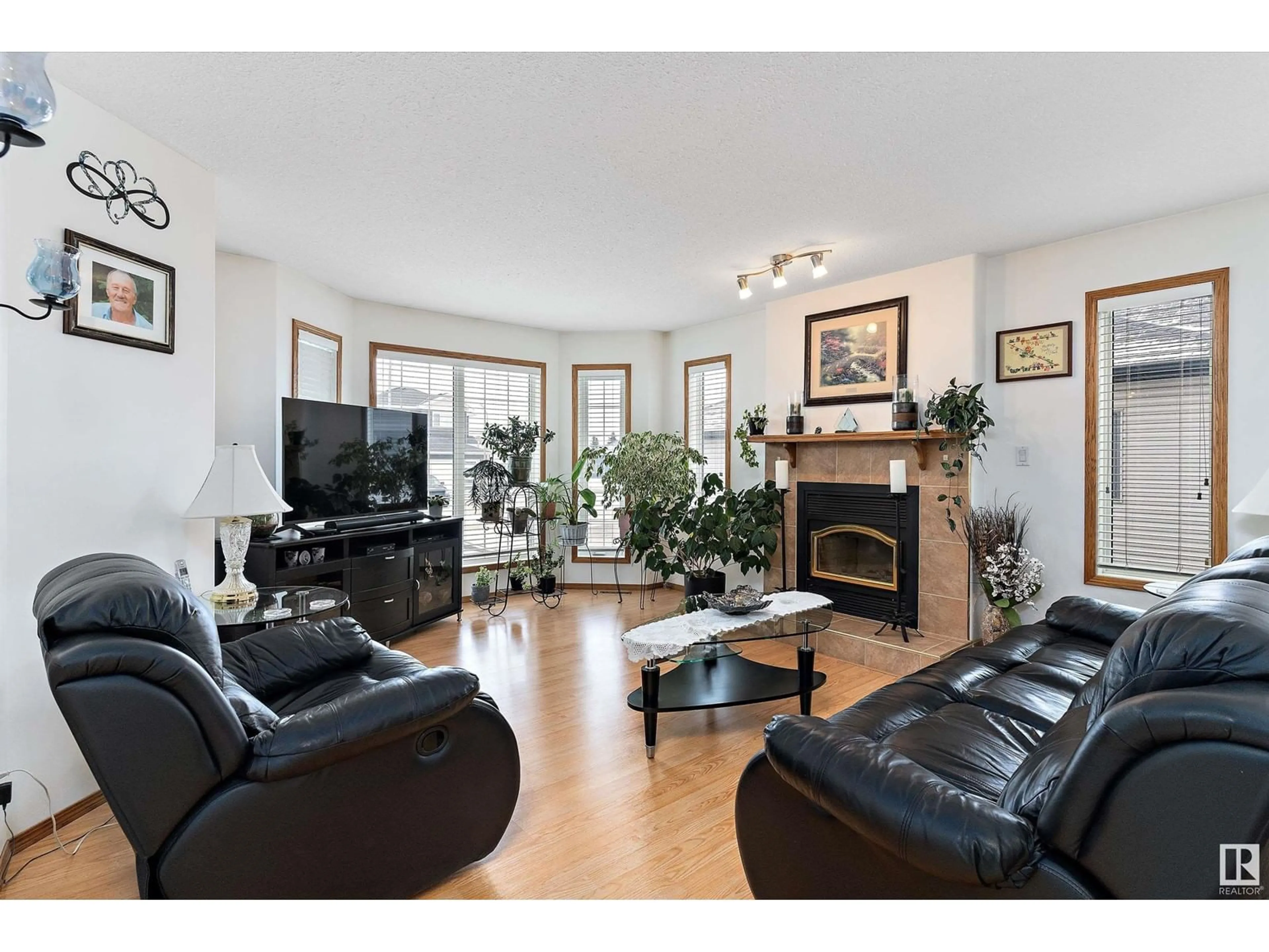 Living room with furniture, wood/laminate floor for 5704 45 ST, Tofield Alberta T0B4J0