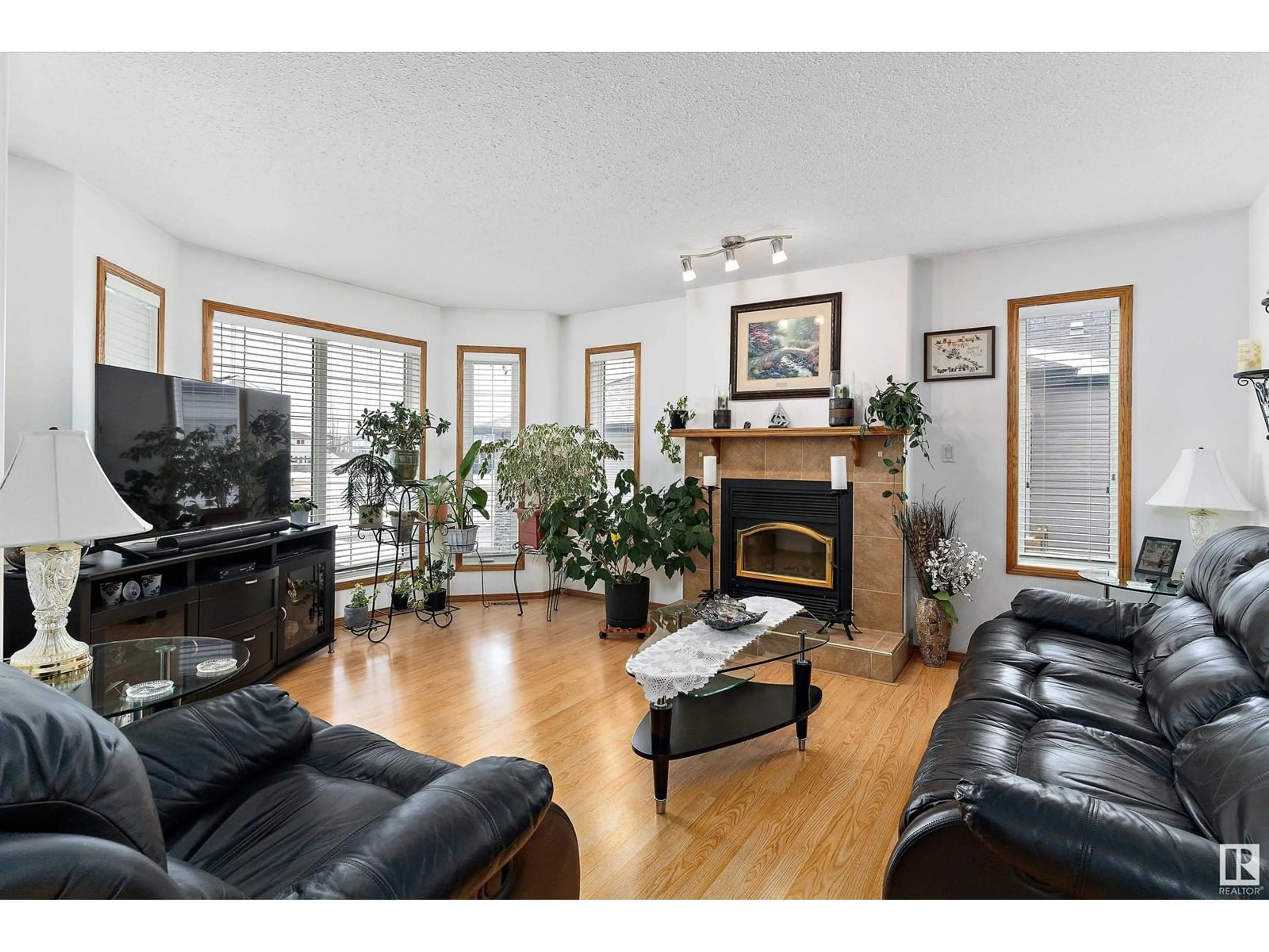 Living room with furniture, wood/laminate floor for 5704 45 ST, Tofield Alberta T0B4J0