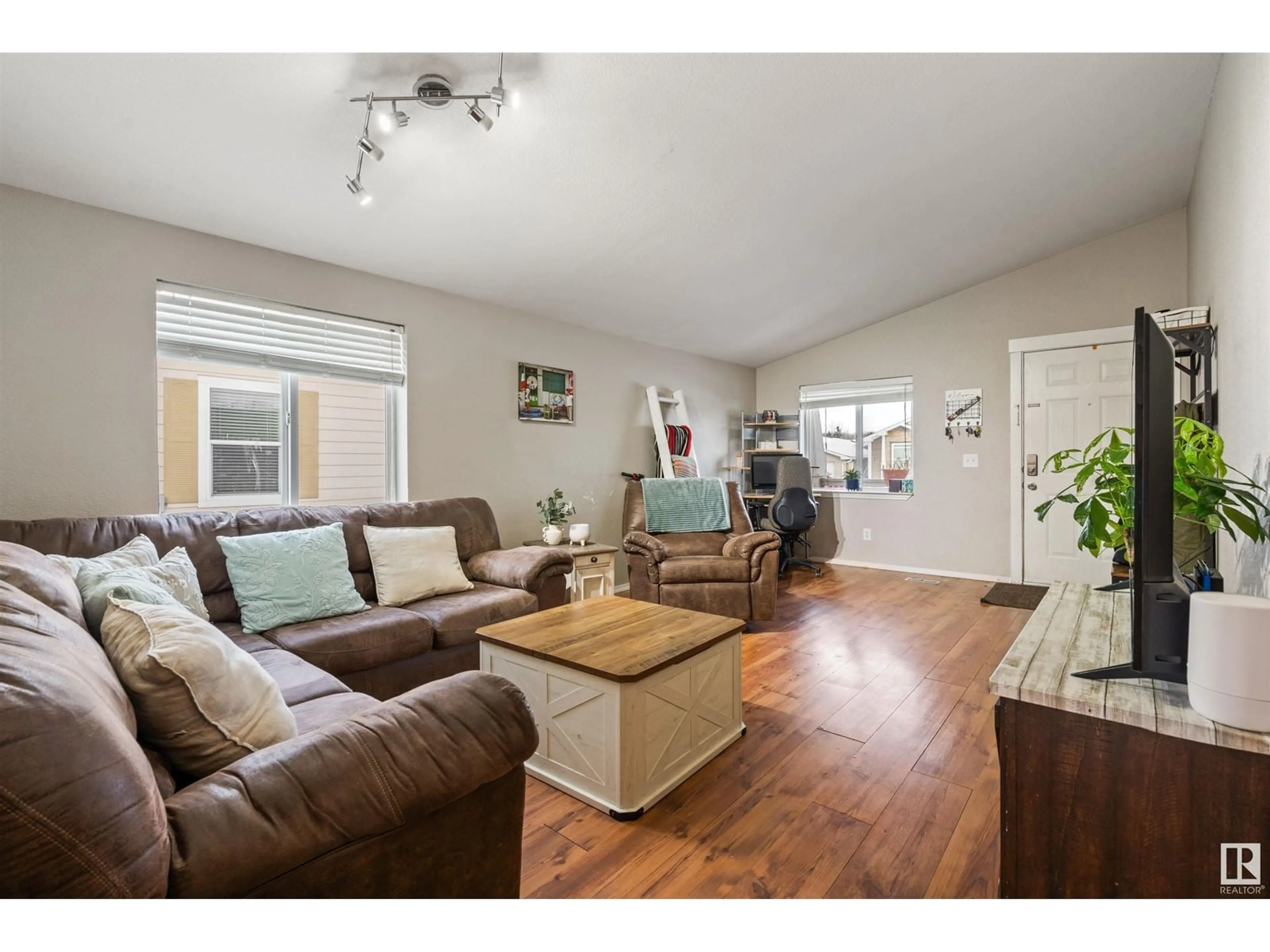 Living room with furniture, wood/laminate floor for 5914 Fontaine DR, Cold Lake Alberta T9M0C6