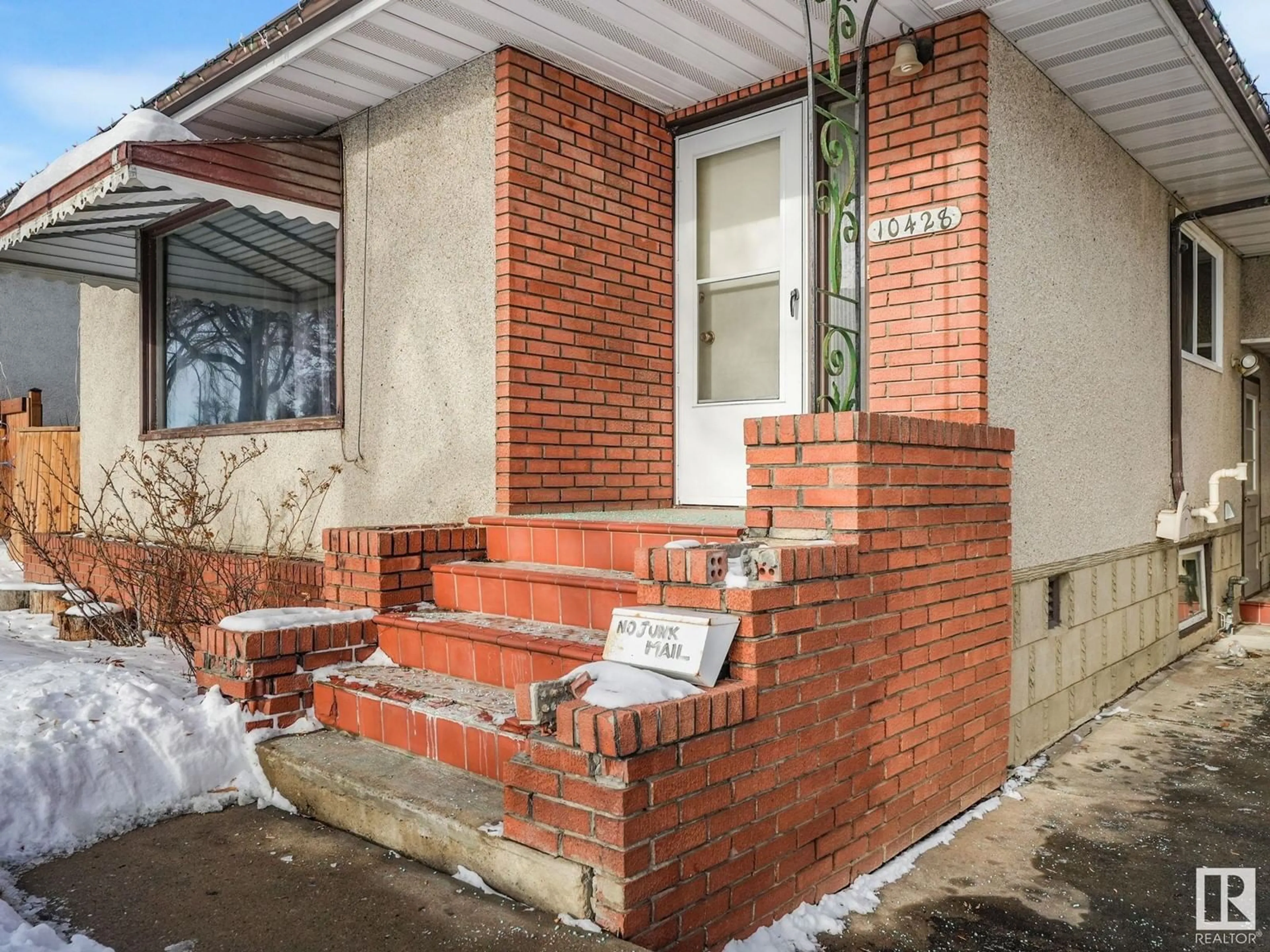 Home with brick exterior material, street for 10428 64 AV NW, Edmonton Alberta T6H1S7