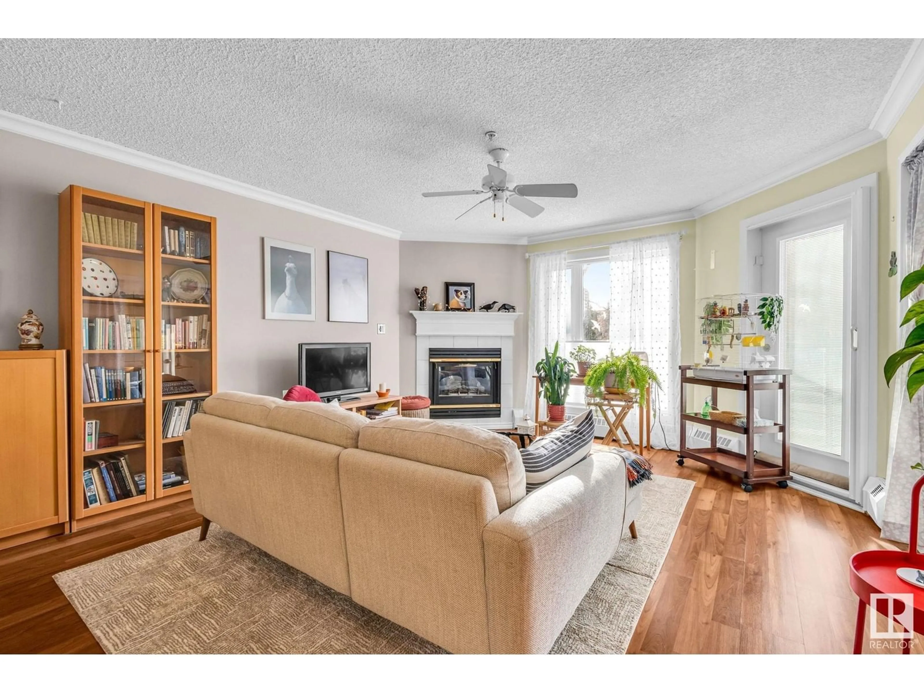 Living room with furniture, wood/laminate floor for #104 9905 112 ST NW NW, Edmonton Alberta T5K1L6