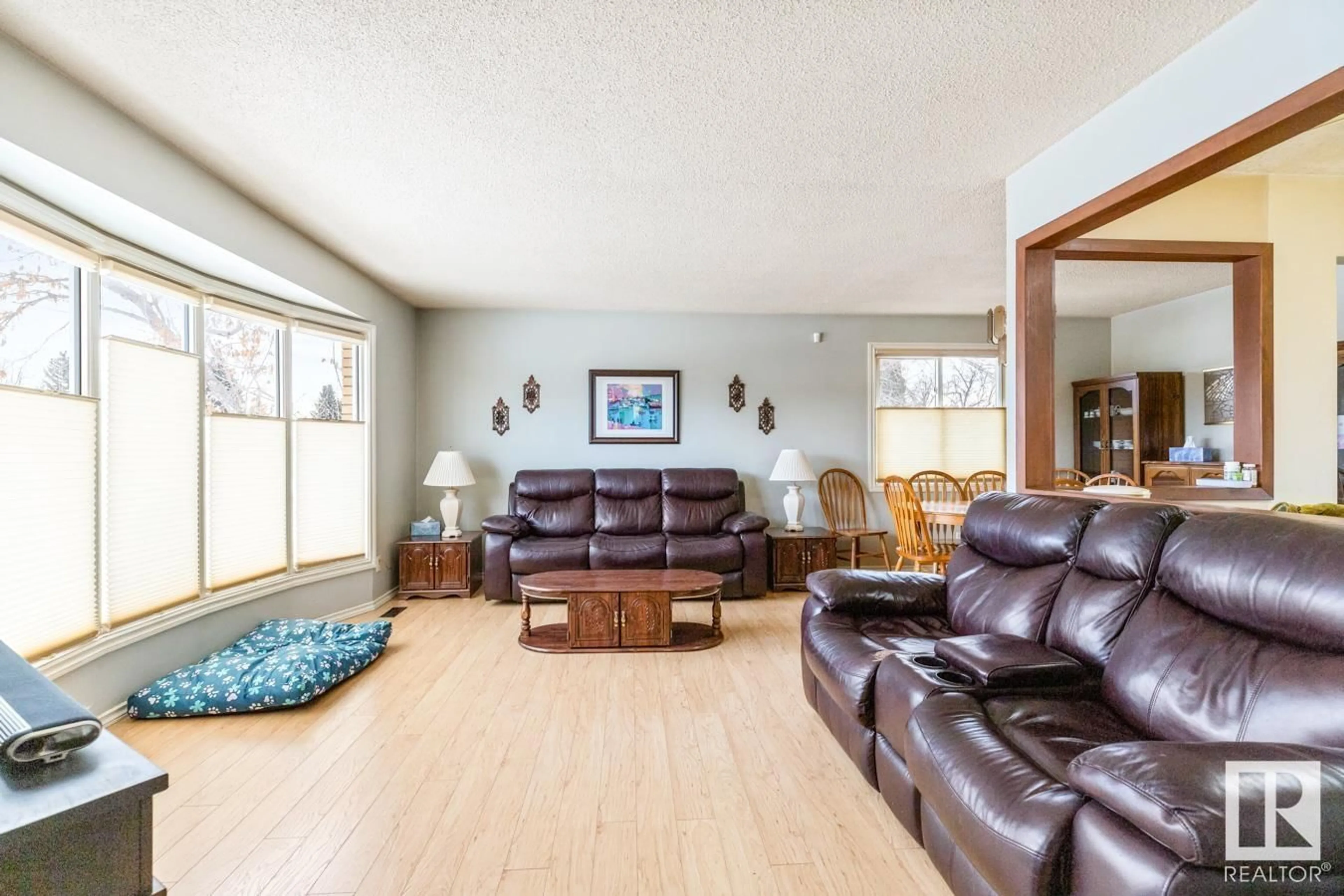 Living room with furniture, wood/laminate floor for 12904 25 ST NW, Edmonton Alberta T5A3Z5