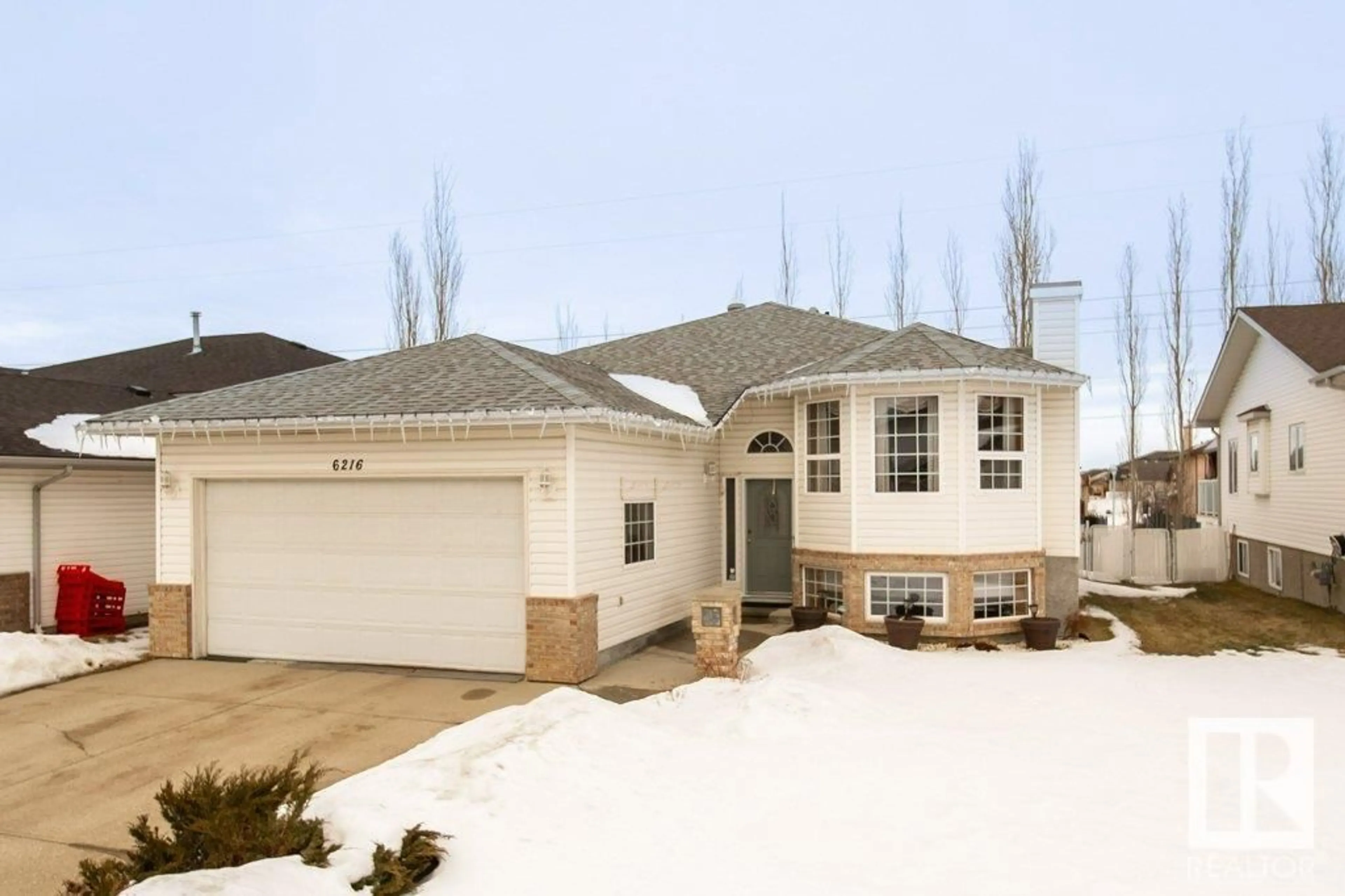 Home with vinyl exterior material, street for 6216 162B AV NW, Edmonton Alberta T5Y2S1