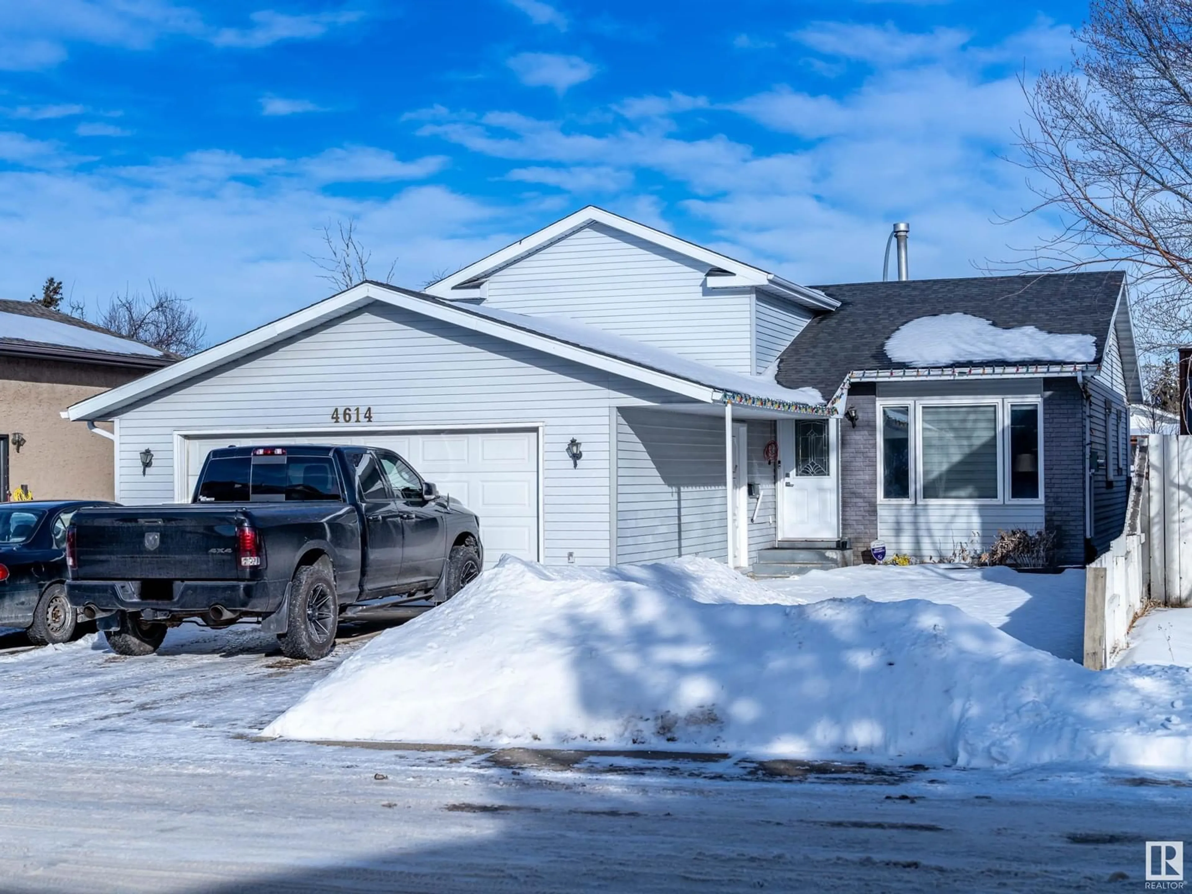 Home with vinyl exterior material, street for 4614 13 AV NW, Edmonton Alberta T6L4A3