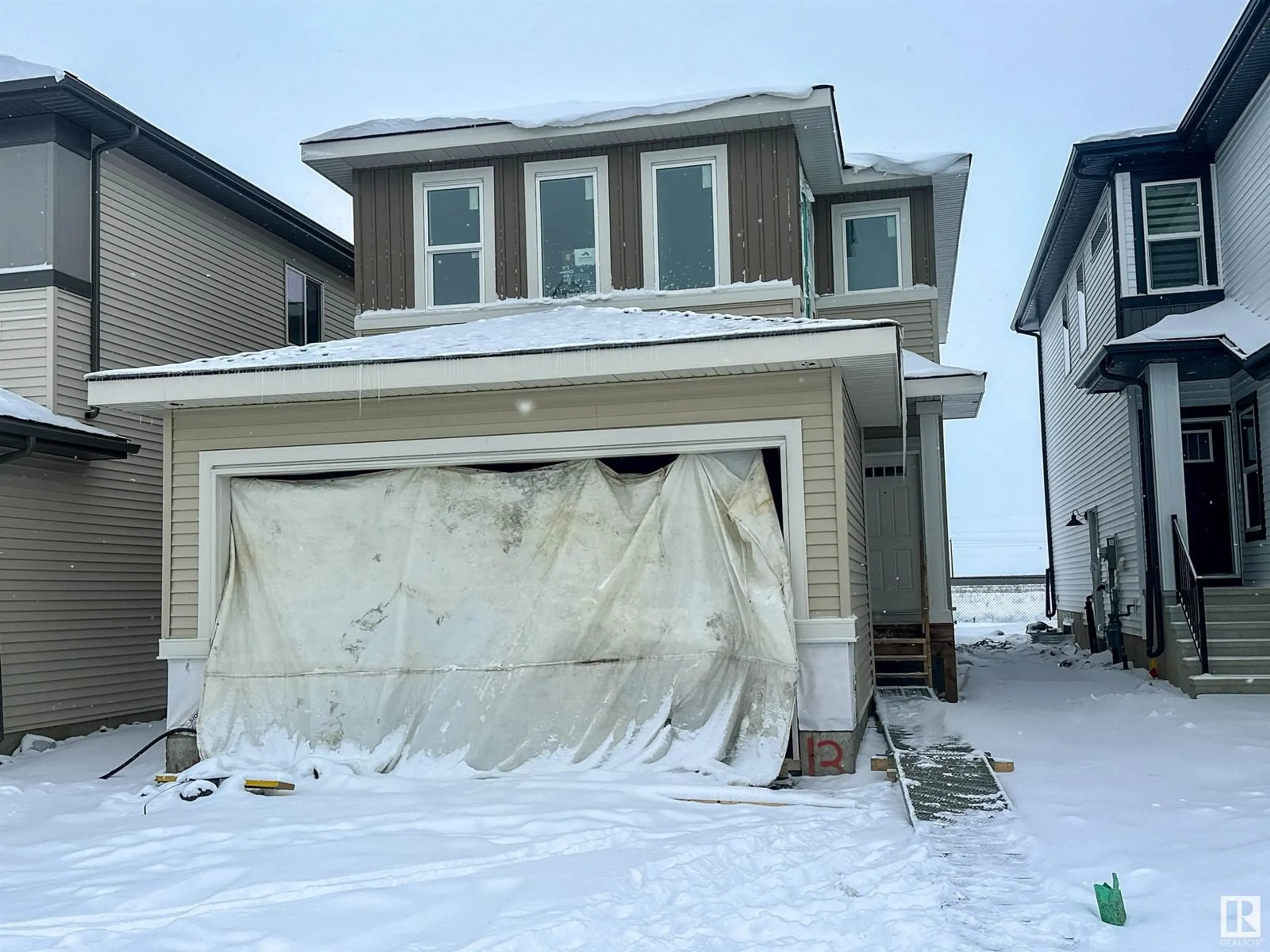 Home with vinyl exterior material, street for 13 SUMAC CL, Fort Saskatchewan Alberta T8L0Z9