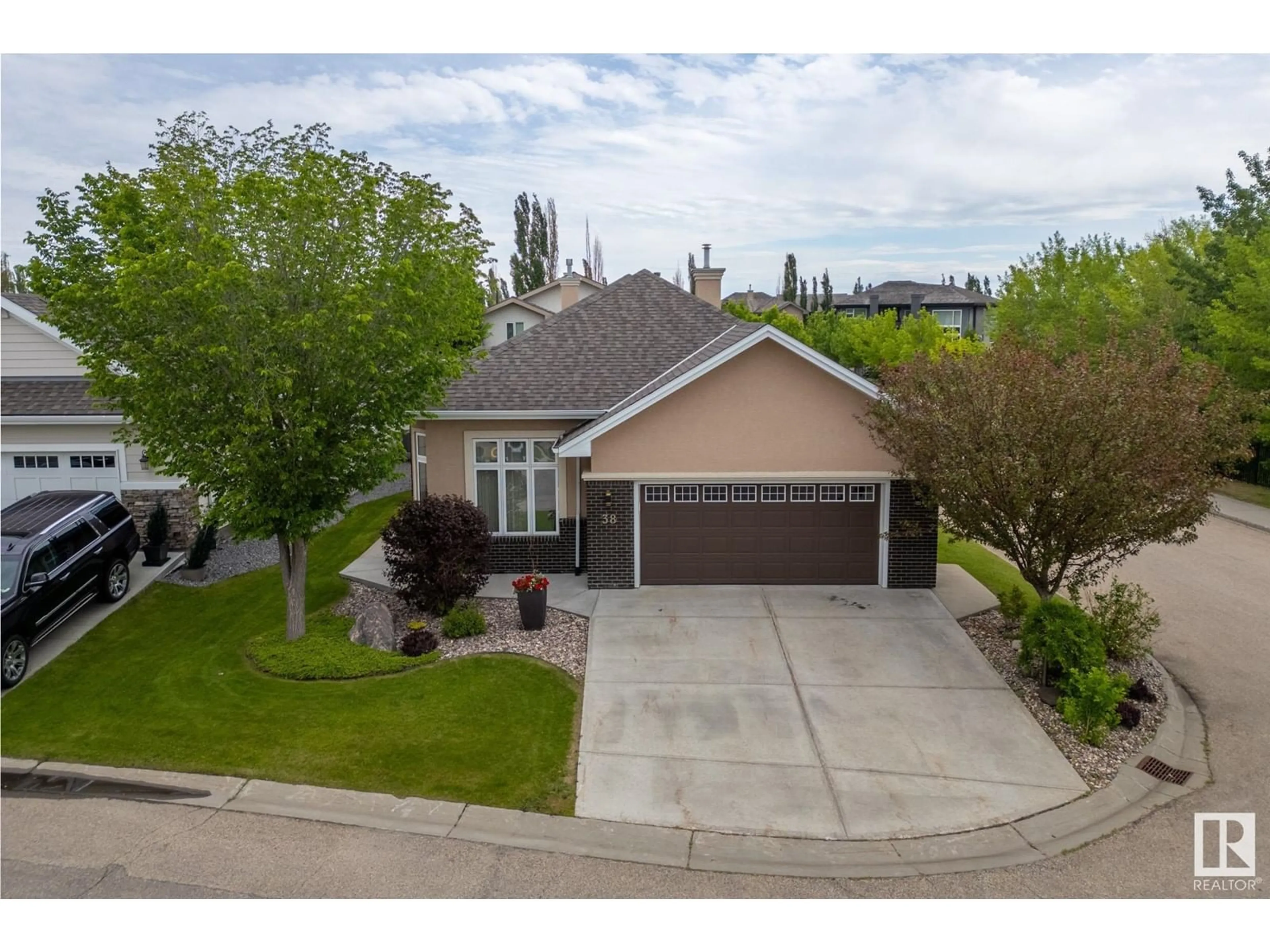 A pic from outside/outdoor area/front of a property/back of a property/a pic from drone, street for #38 18343 LESSARD RD NW, Edmonton Alberta T6M0A2