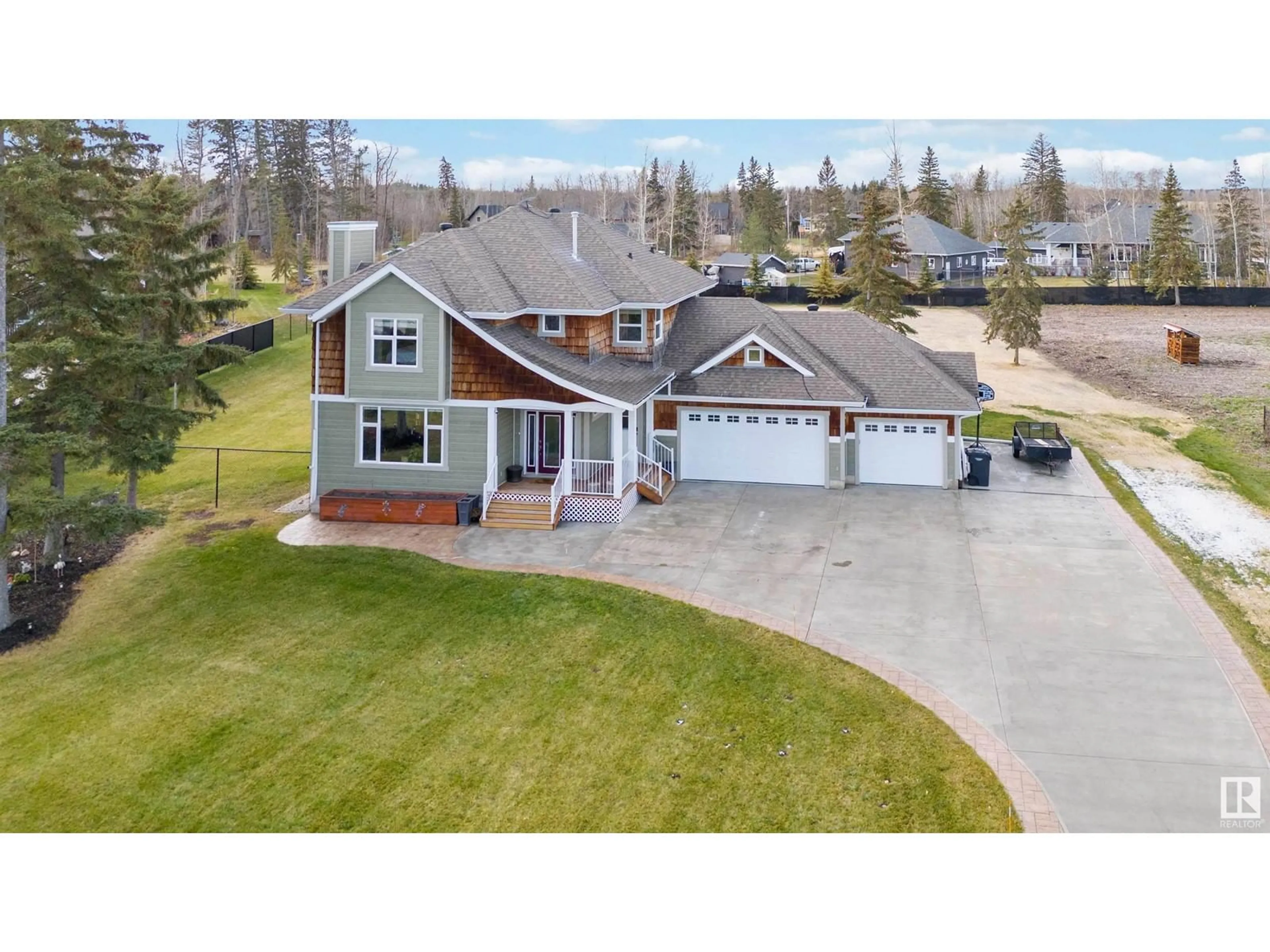 A pic from outside/outdoor area/front of a property/back of a property/a pic from drone, street for 67 53305 Rge Rd 273, Rural Parkland County Alberta T7X3N3