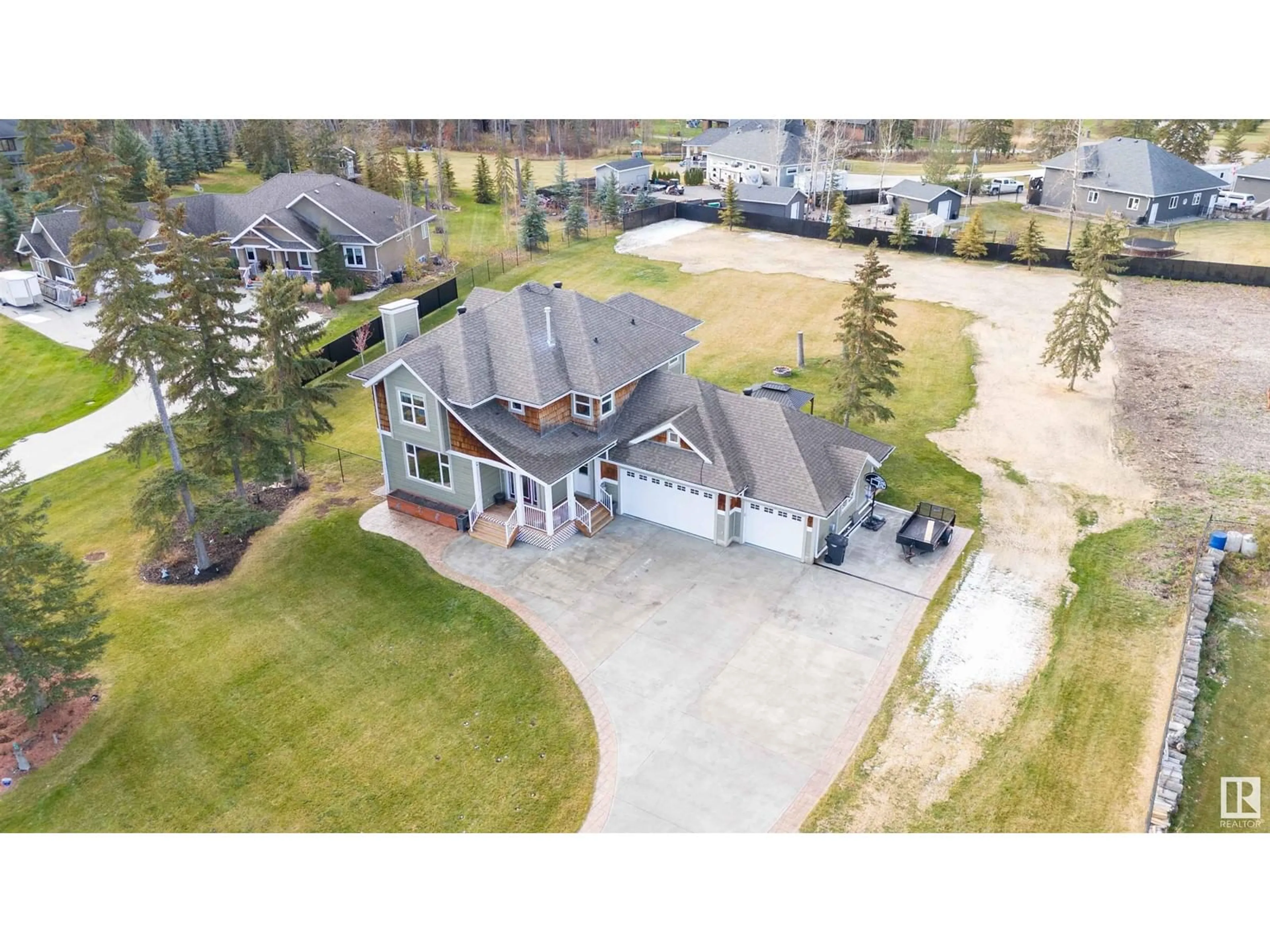 A pic from outside/outdoor area/front of a property/back of a property/a pic from drone, street for 67 53305 Rge Rd 273, Rural Parkland County Alberta T7X3N3