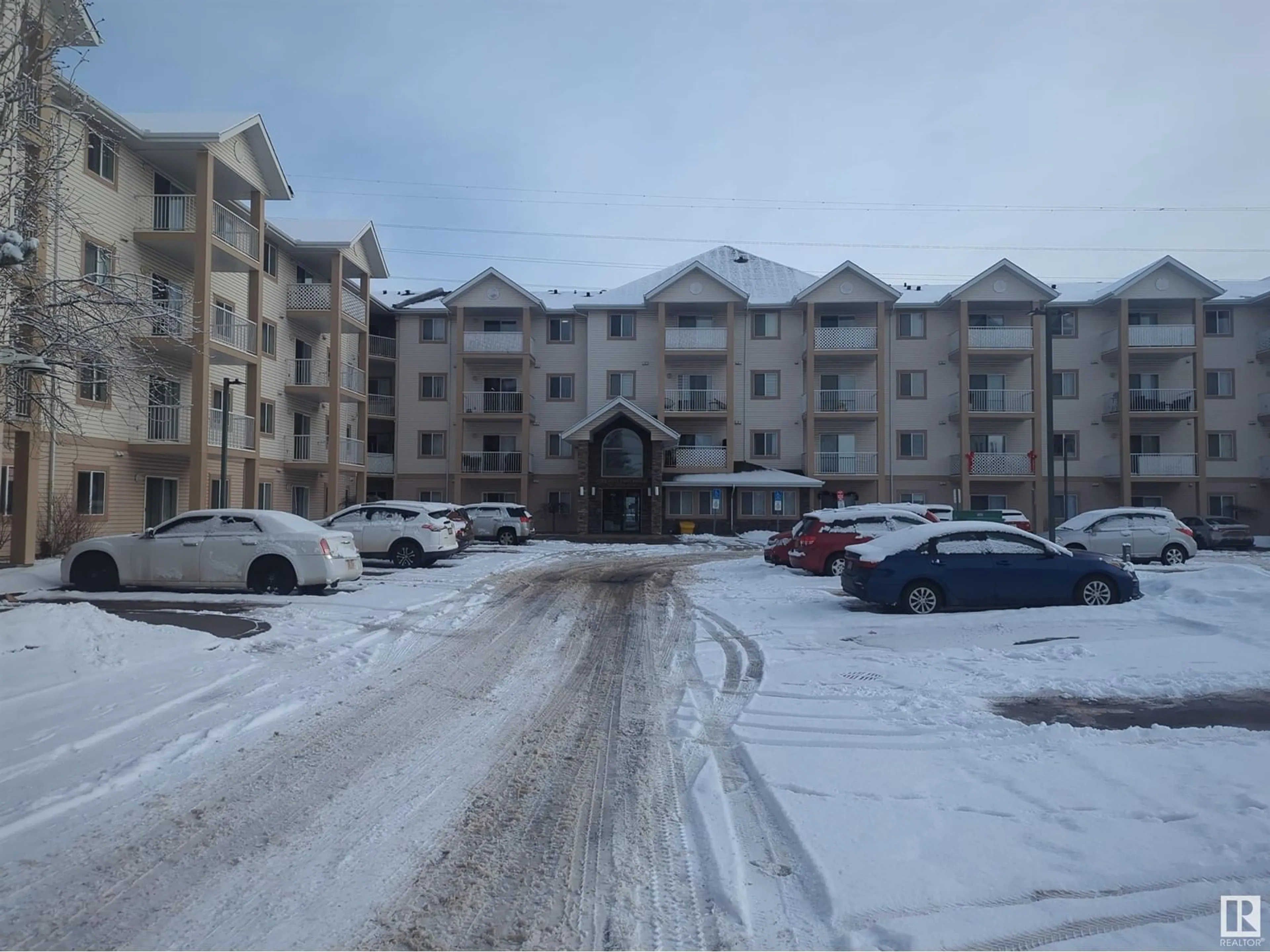 A pic from outside/outdoor area/front of a property/back of a property/a pic from drone, mountain view for #105 245 EDWARDS DR SW, Edmonton Alberta T6X1J9