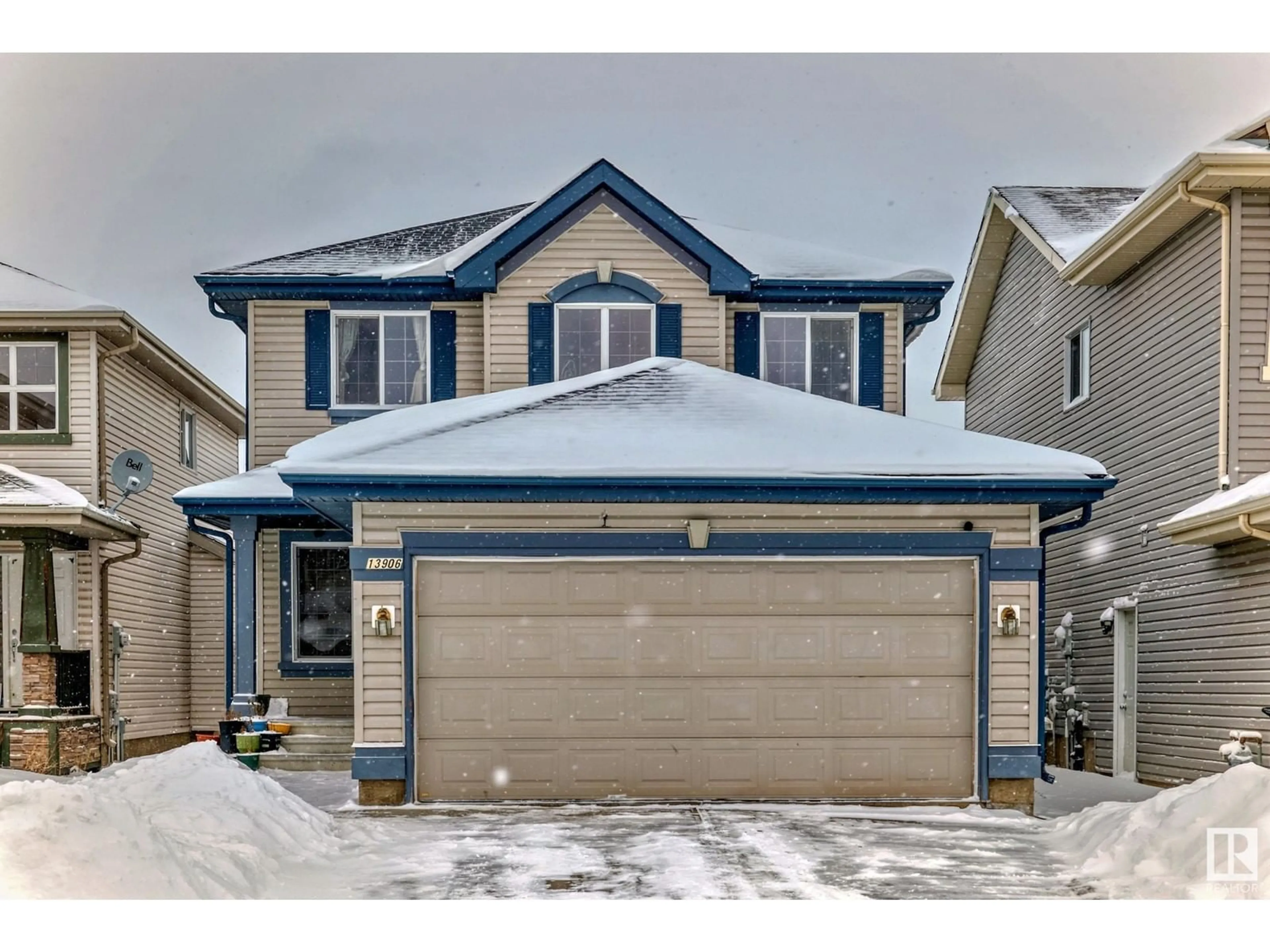 Home with vinyl exterior material, street for 13906 146 AV NW NW, Edmonton Alberta T6V1X9