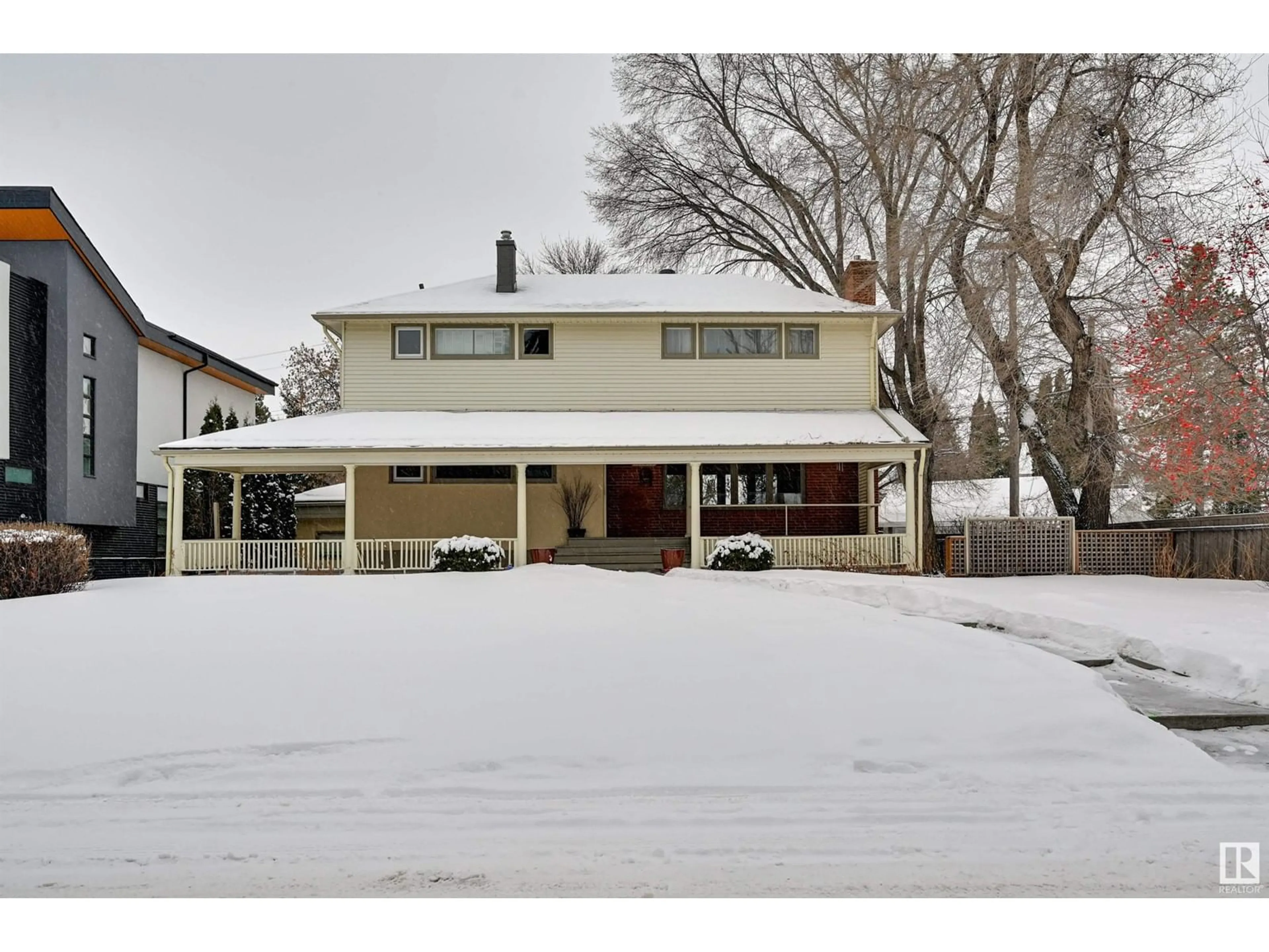 Home with vinyl exterior material, street for 13607 101 AV NW, Edmonton Alberta T5N0J4