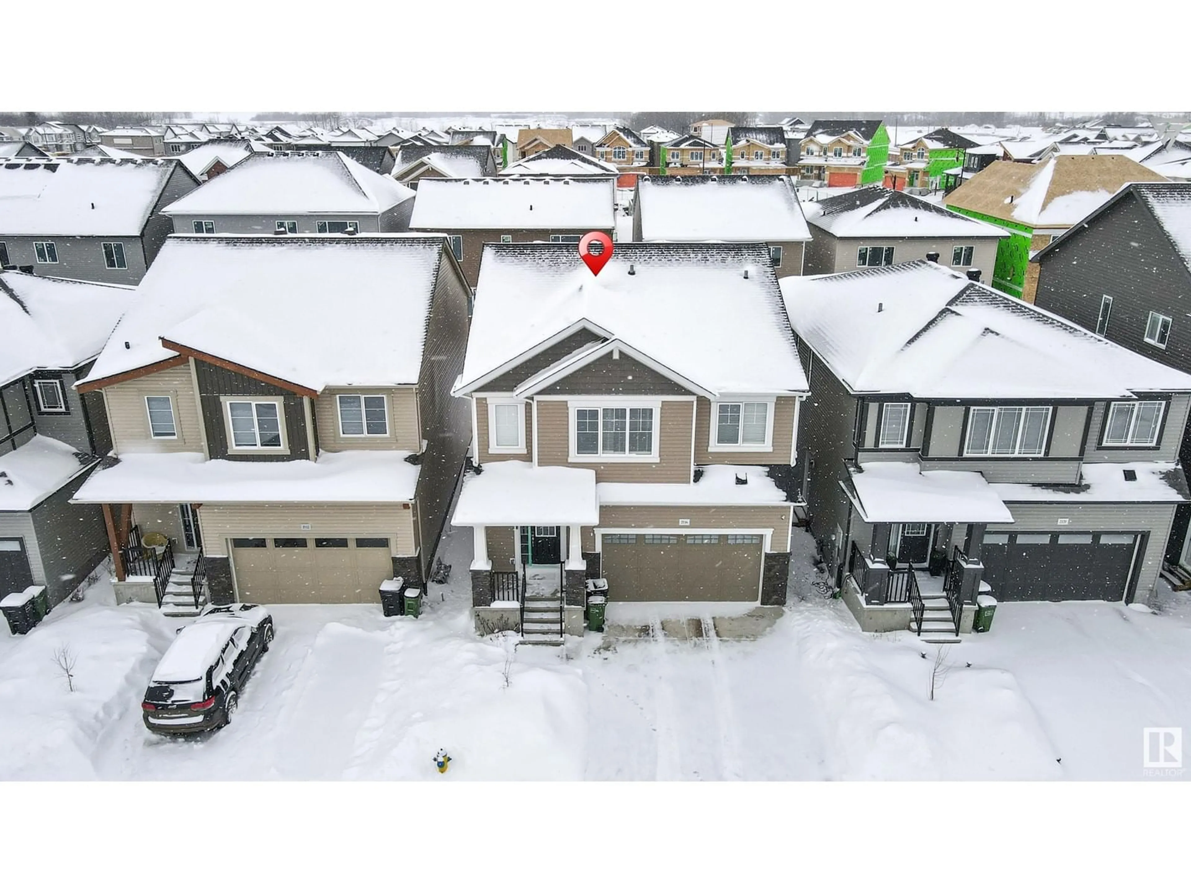 A pic from outside/outdoor area/front of a property/back of a property/a pic from drone, street for 2116 207 ST NW, Edmonton Alberta T6M1N3