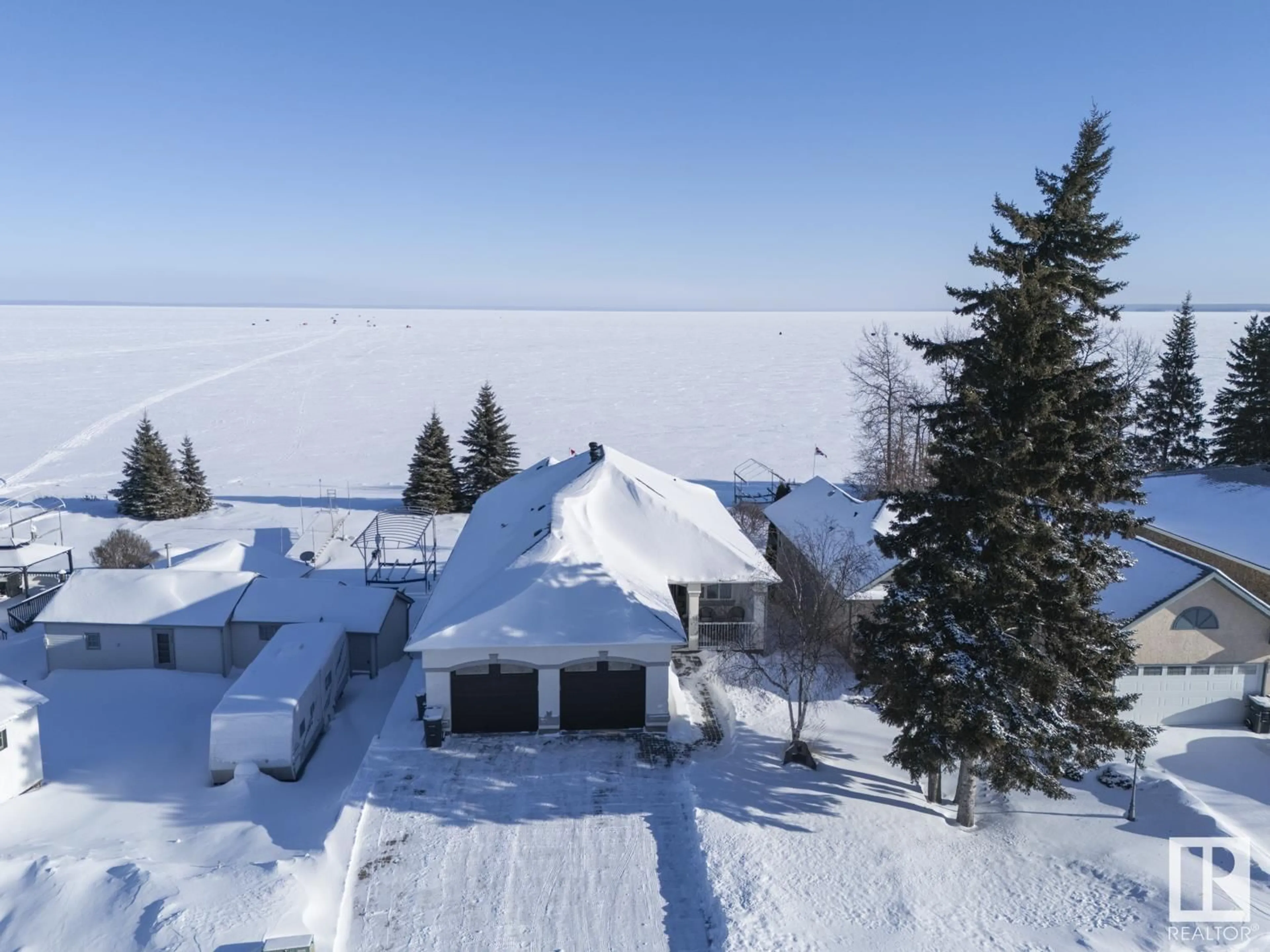 A pic from outside/outdoor area/front of a property/back of a property/a pic from drone, street for 718 Beach AV, Cold Lake Alberta T9M1G5