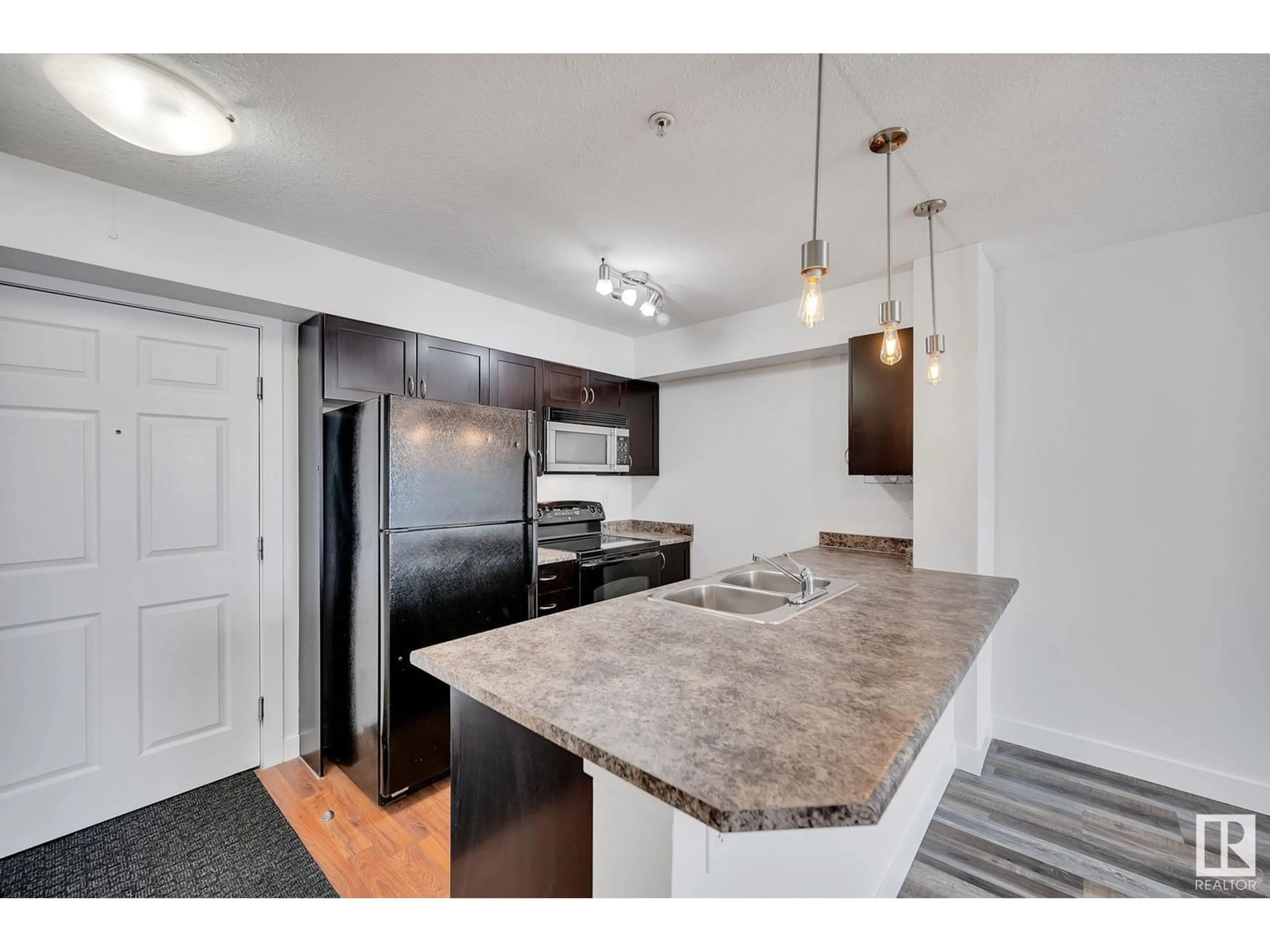 Open concept kitchen, unknown for #112 920 156 ST NW, Edmonton Alberta T6R0N6