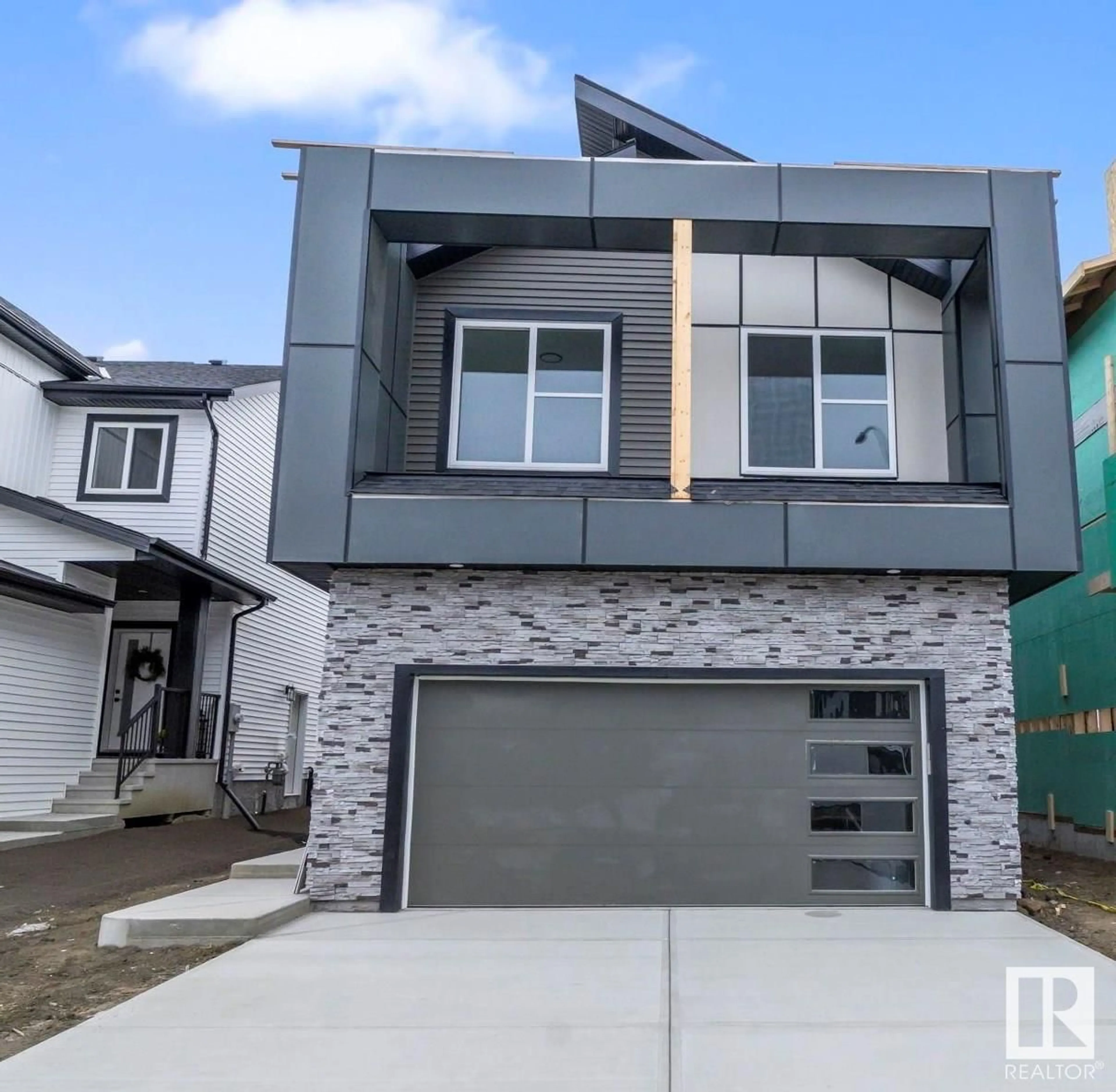 Home with brick exterior material, street for 203 Starling Way WY, Fort Saskatchewan Alberta T8N8A1