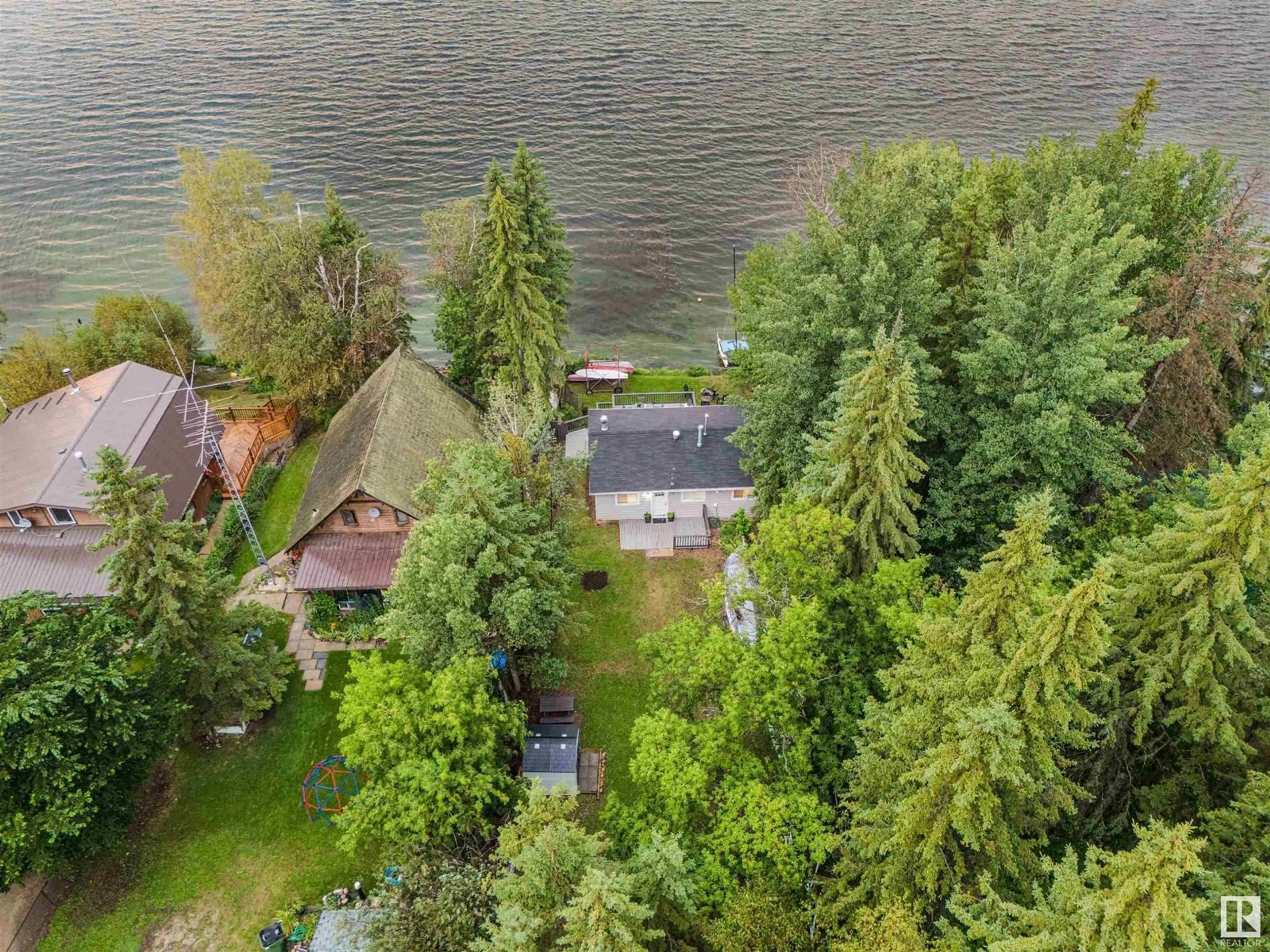 A pic from outside/outdoor area/front of a property/back of a property/a pic from drone, water/lake/river/ocean view for 13 FIR AV, Rural Lac Ste. Anne County Alberta T0E0L0