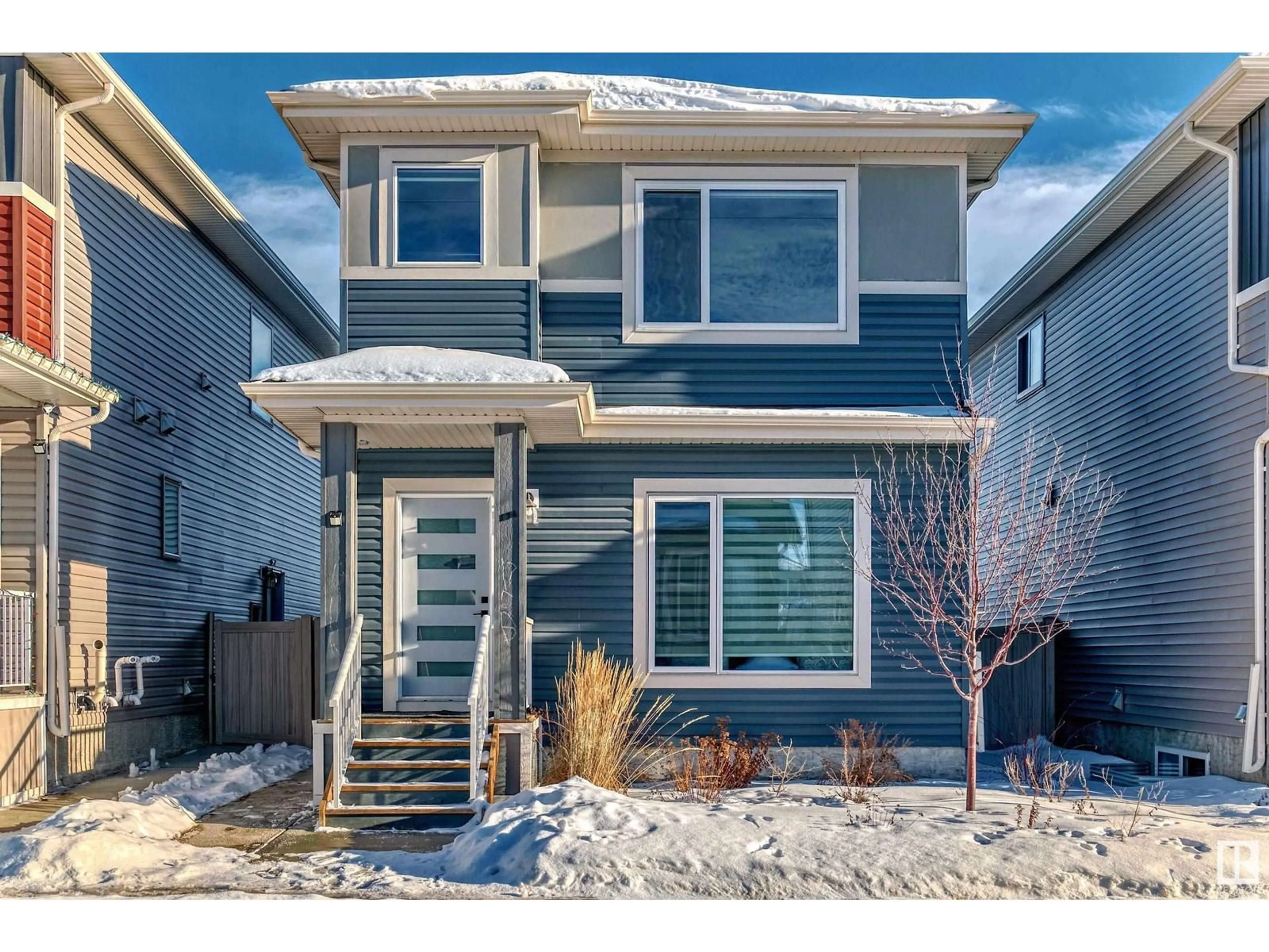 Home with vinyl exterior material, street for 1716 25 ST NW, Edmonton Alberta T6T2J1