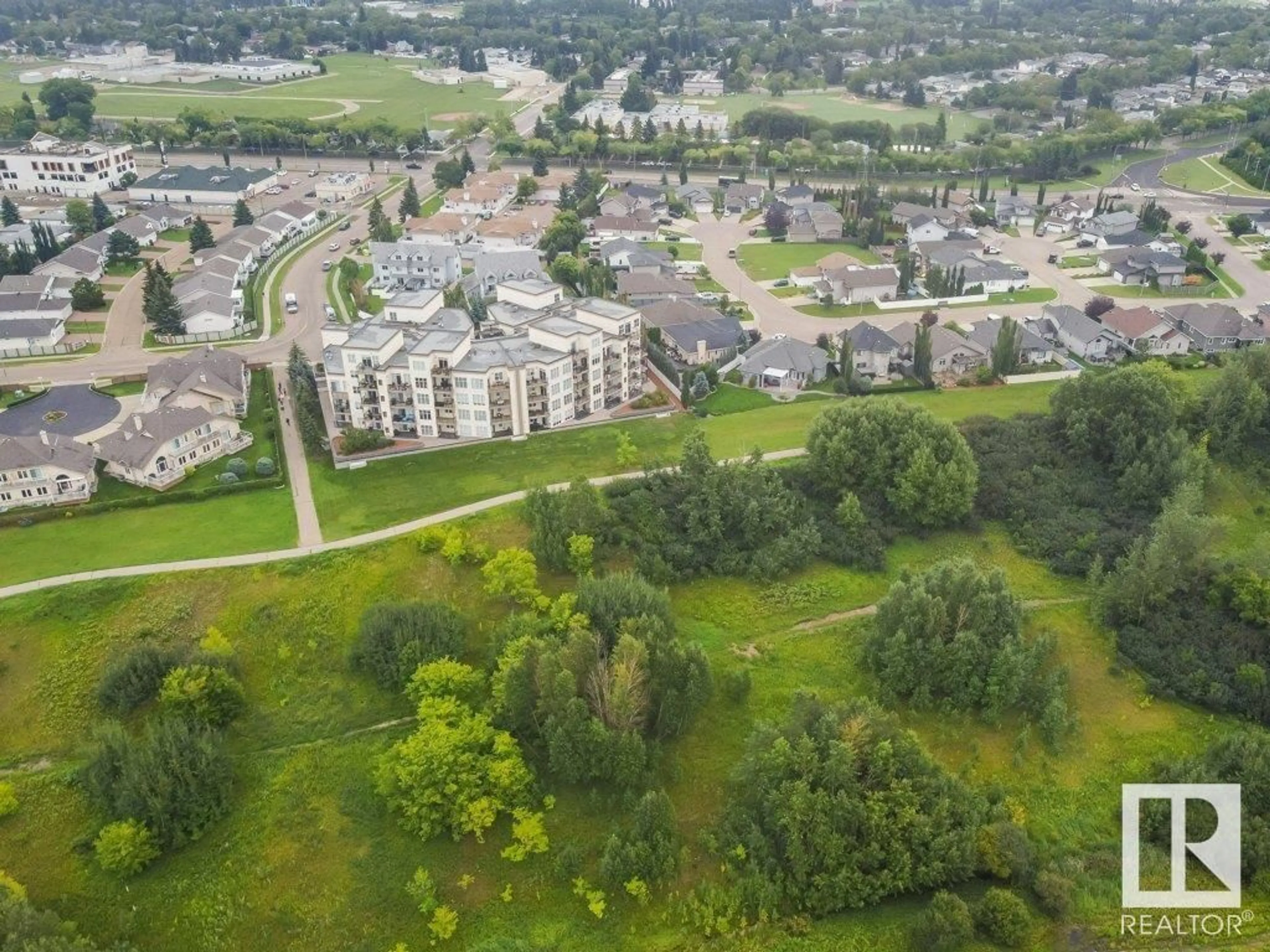 A pic from outside/outdoor area/front of a property/back of a property/a pic from drone, mountain view for #404 9940 SHERRIDON DR, Fort Saskatchewan Alberta T8L4C9