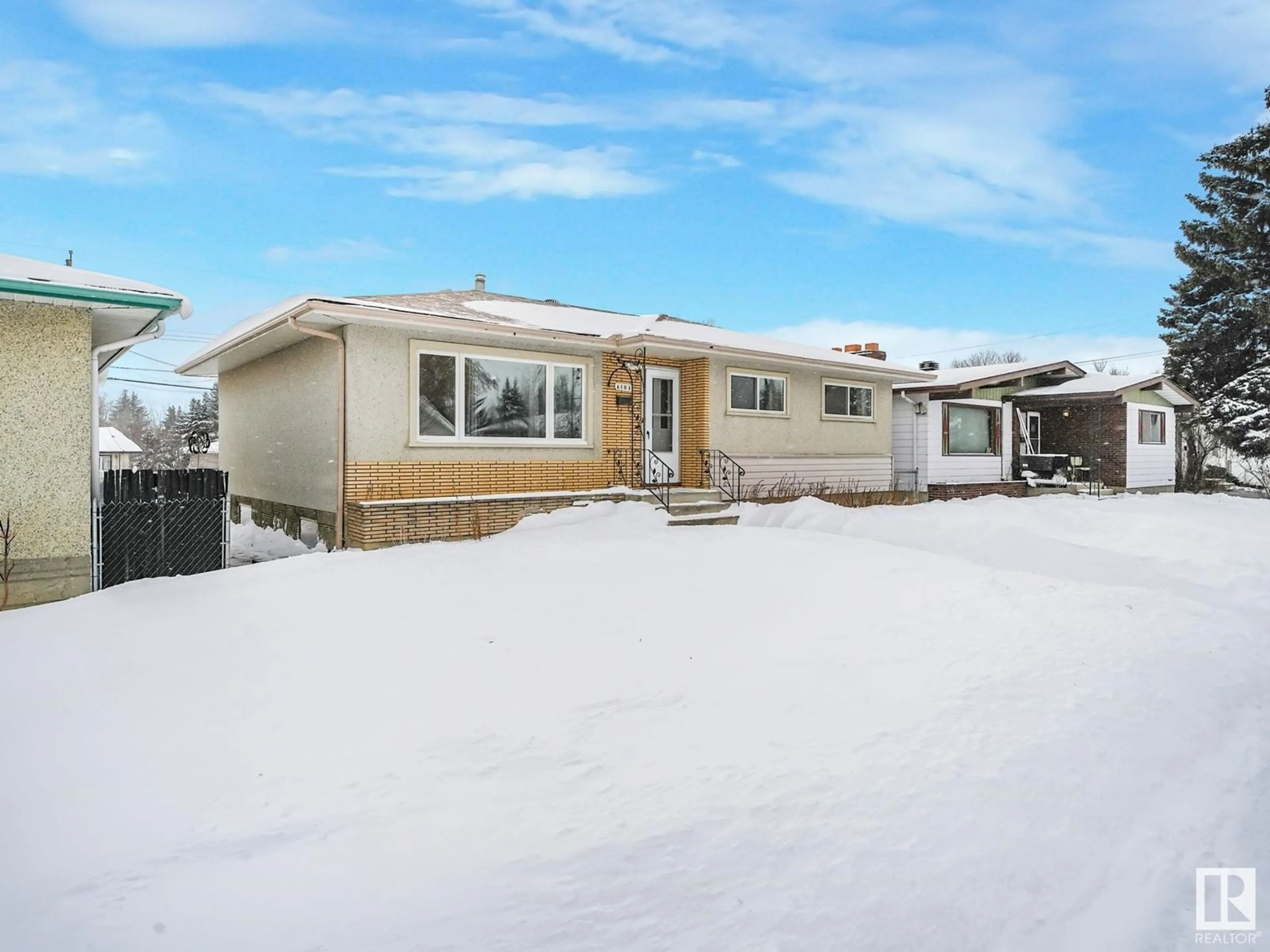 Home with vinyl exterior material, street for 6103 132 AV NW, Edmonton Alberta T5A0J8