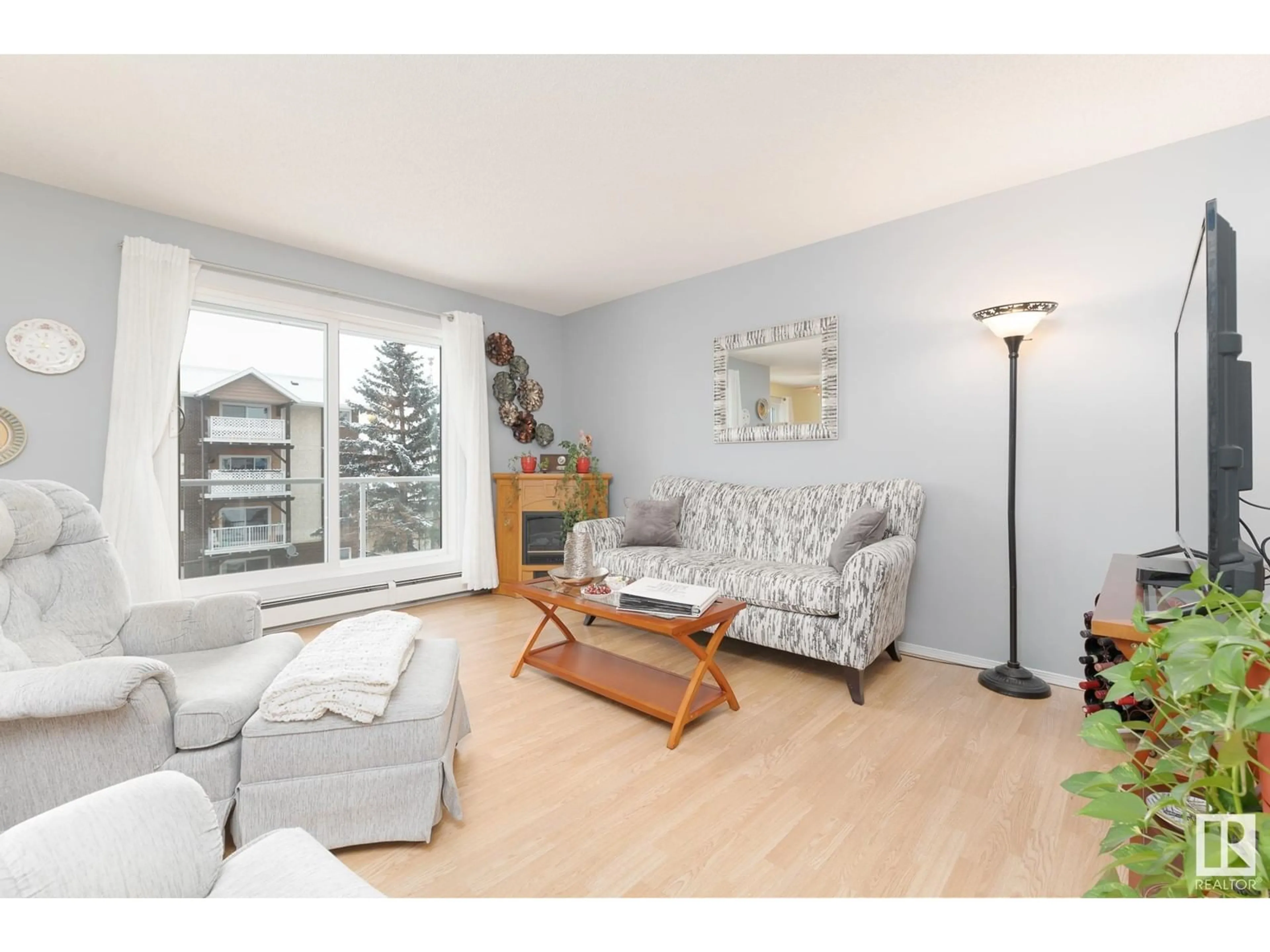 Living room with furniture, wood/laminate floor for #303 224 CHURCH RD, Spruce Grove Alberta T7X3E9