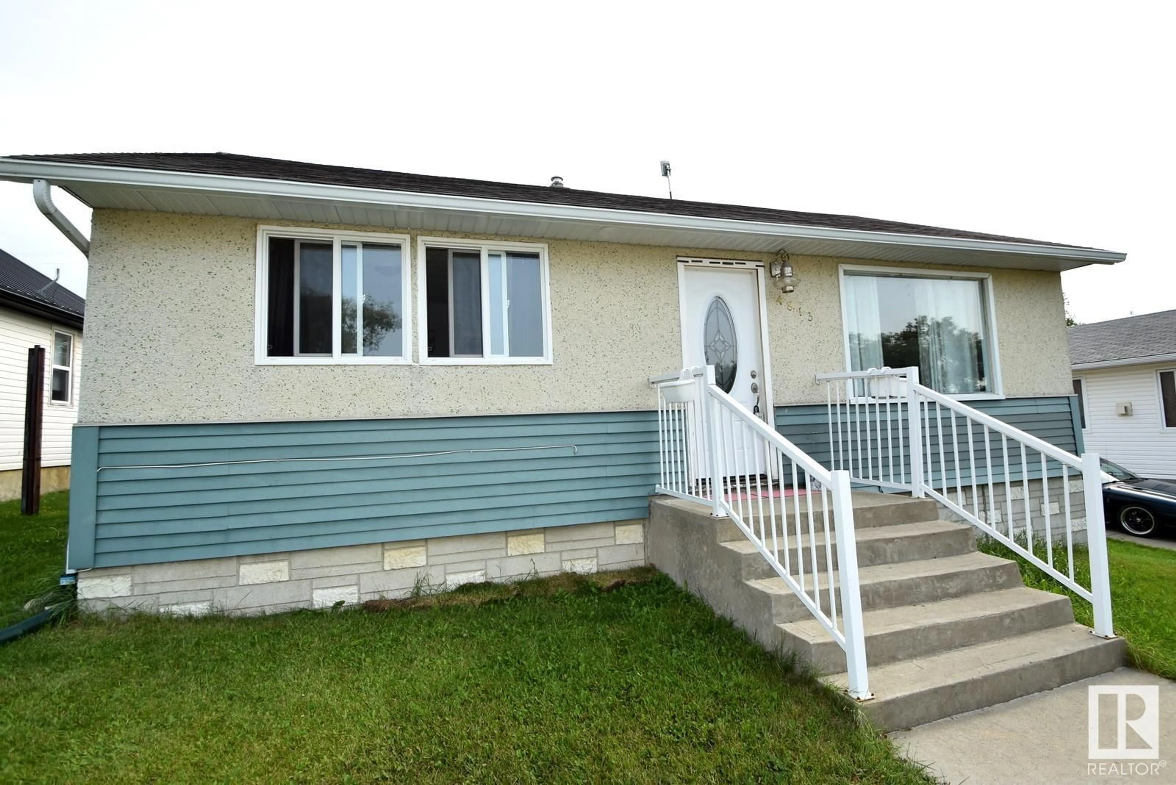 Home with vinyl exterior material, street for 4813 51 ST, Kitscoty Alberta T0B2P0