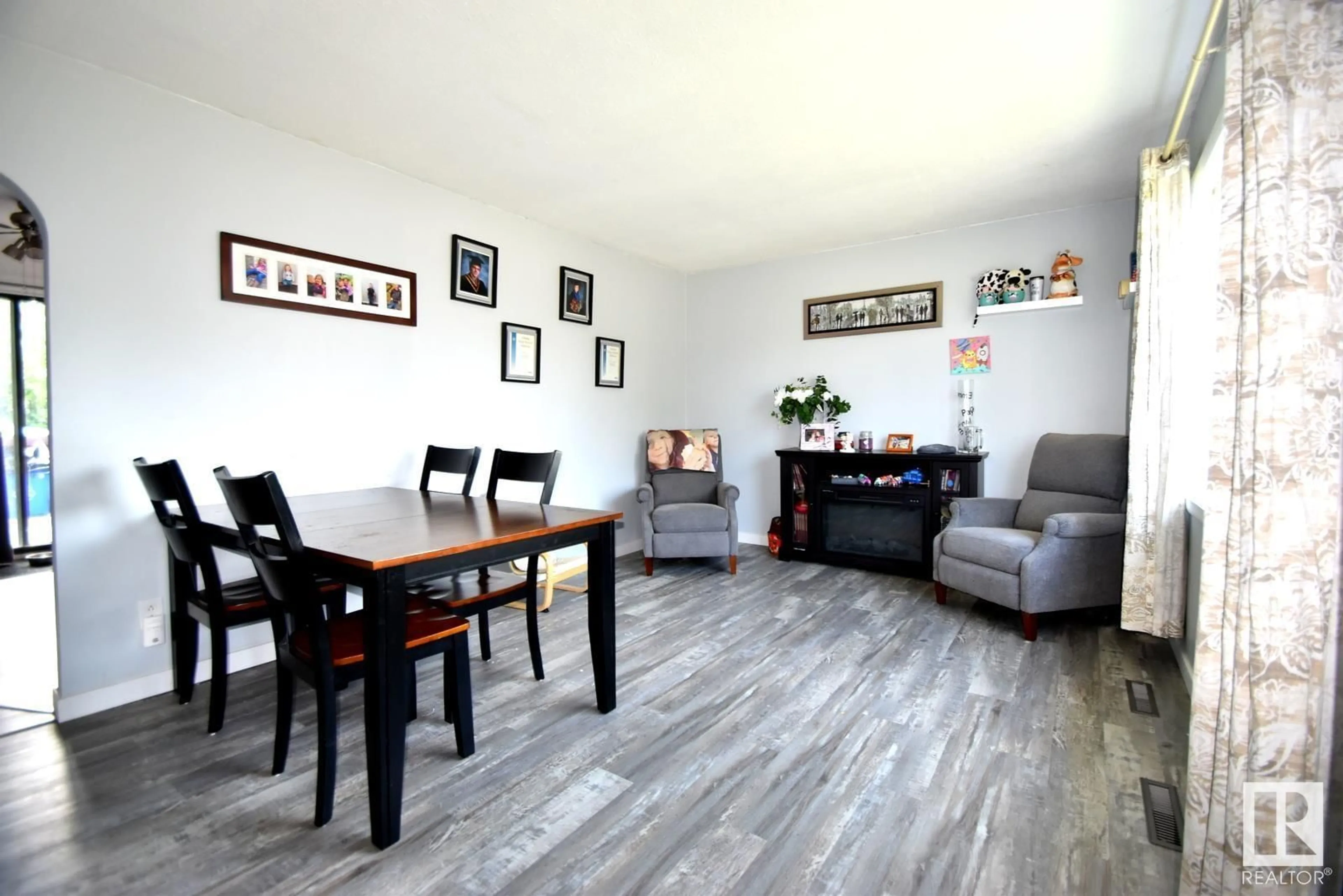 Living room with furniture, wood/laminate floor for 4813 51 ST, Kitscoty Alberta T0B2P0