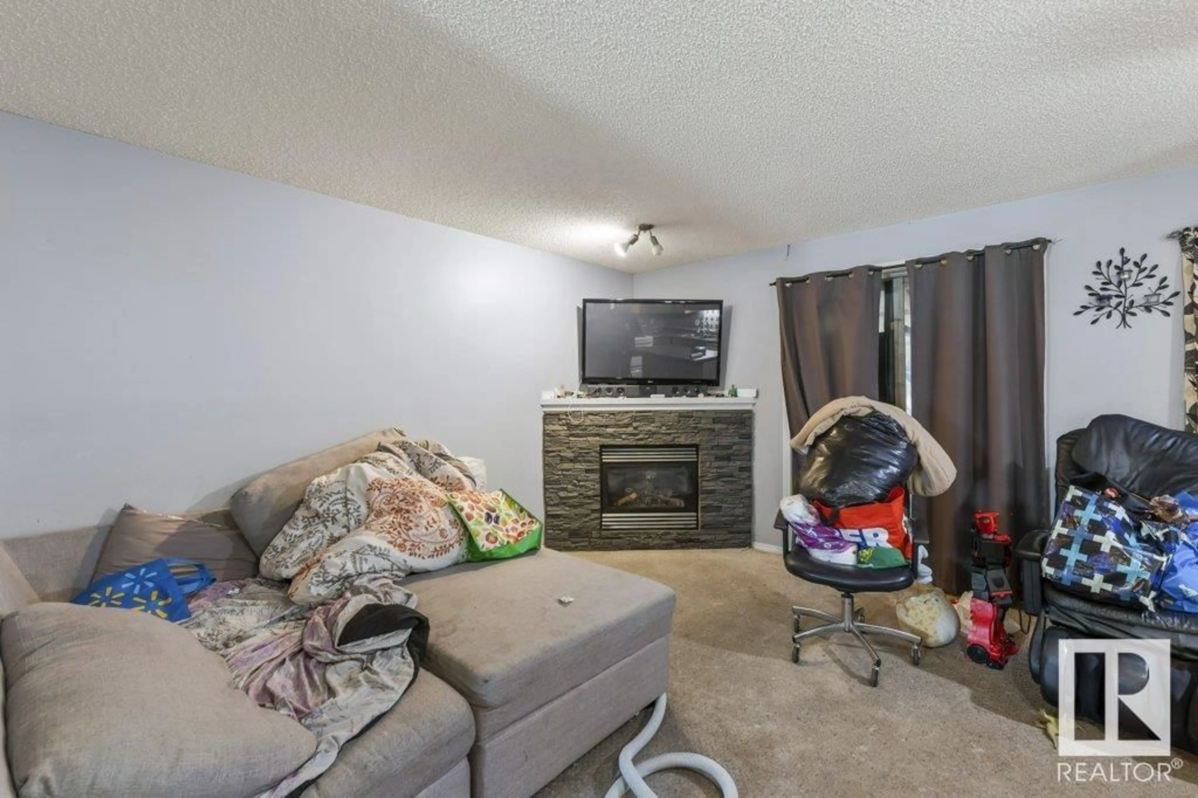 Living room with furniture, unknown for 7931 7 AV SW, Edmonton Alberta T6X1N3