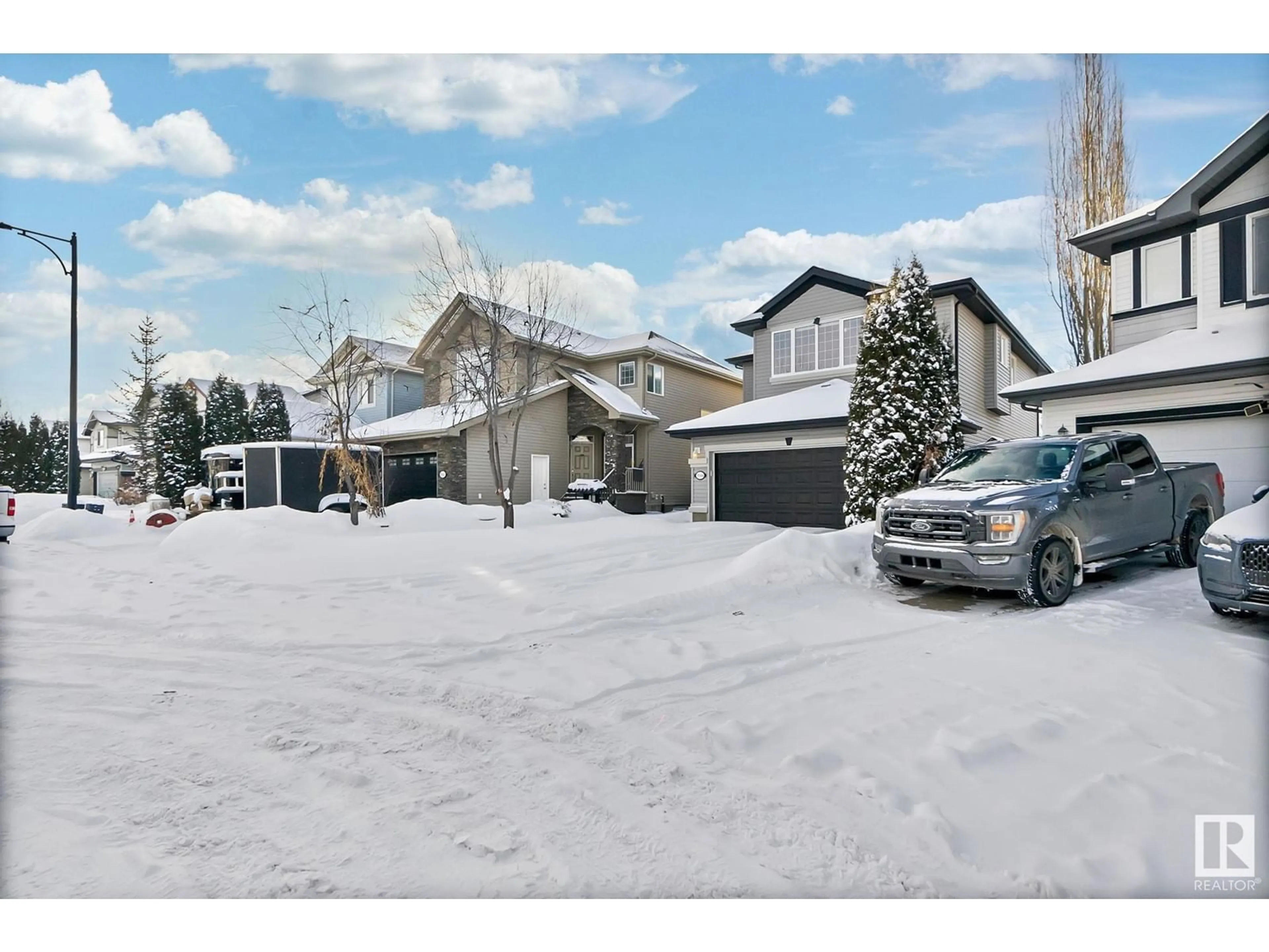 A pic from outside/outdoor area/front of a property/back of a property/a pic from drone, street for 5844 214 ST NW, Edmonton Alberta T6M0H4