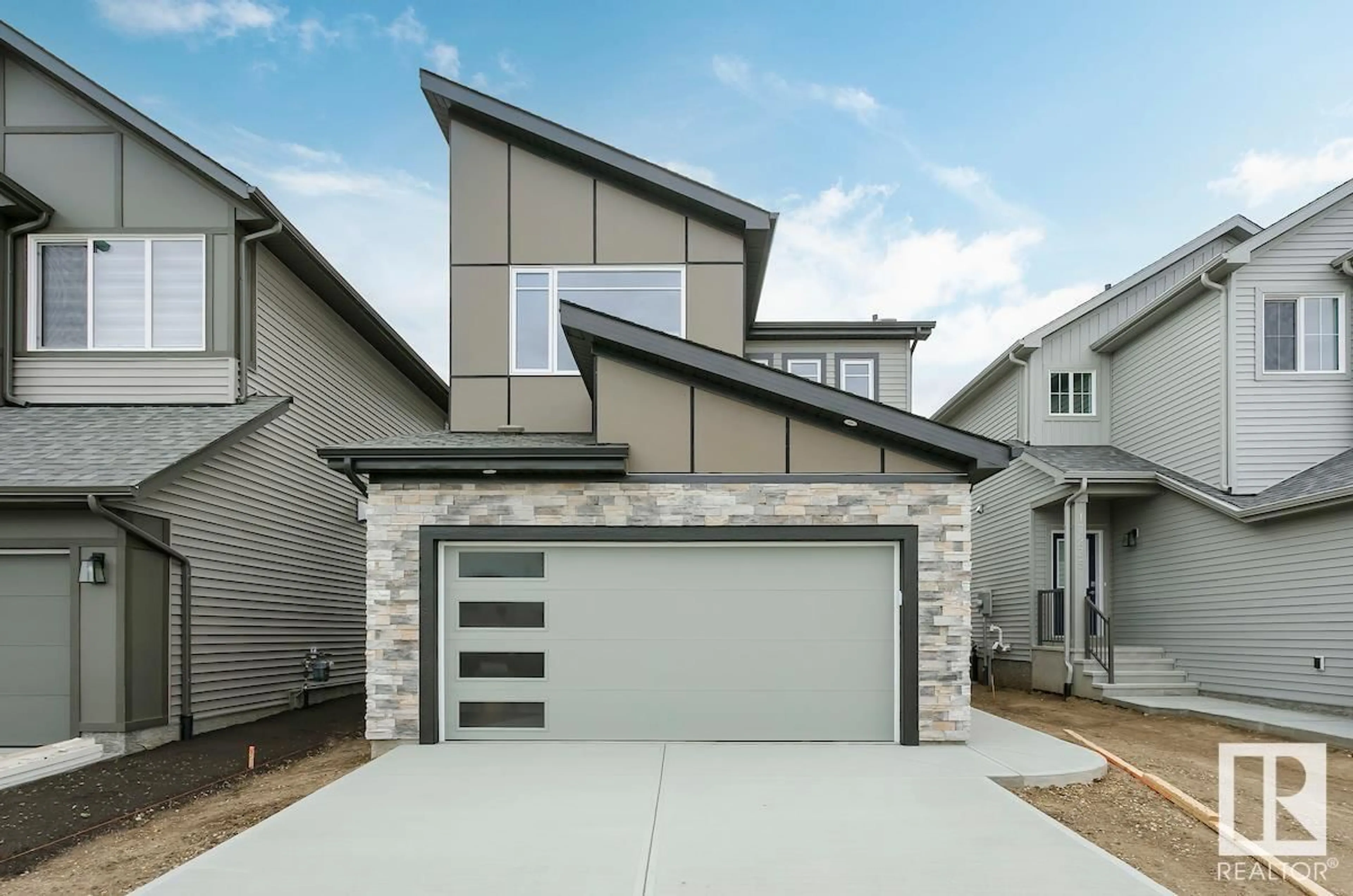 Home with vinyl exterior material, street for 17239 2 ST NW, Edmonton Alberta T5Y4G5