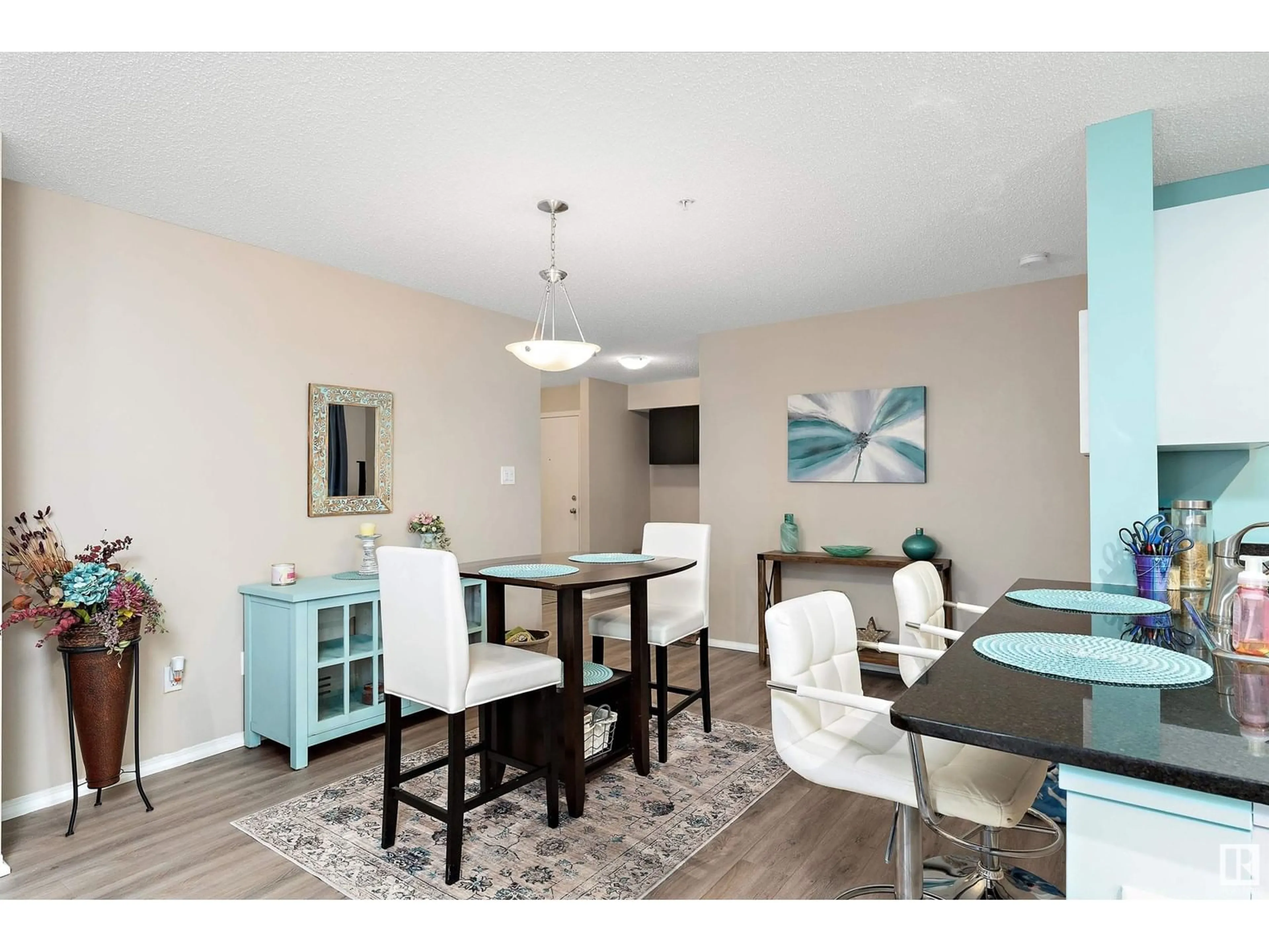 Dining room, wood/laminate floor for #102 11812 22 AV SW, Edmonton Alberta T6W2A2