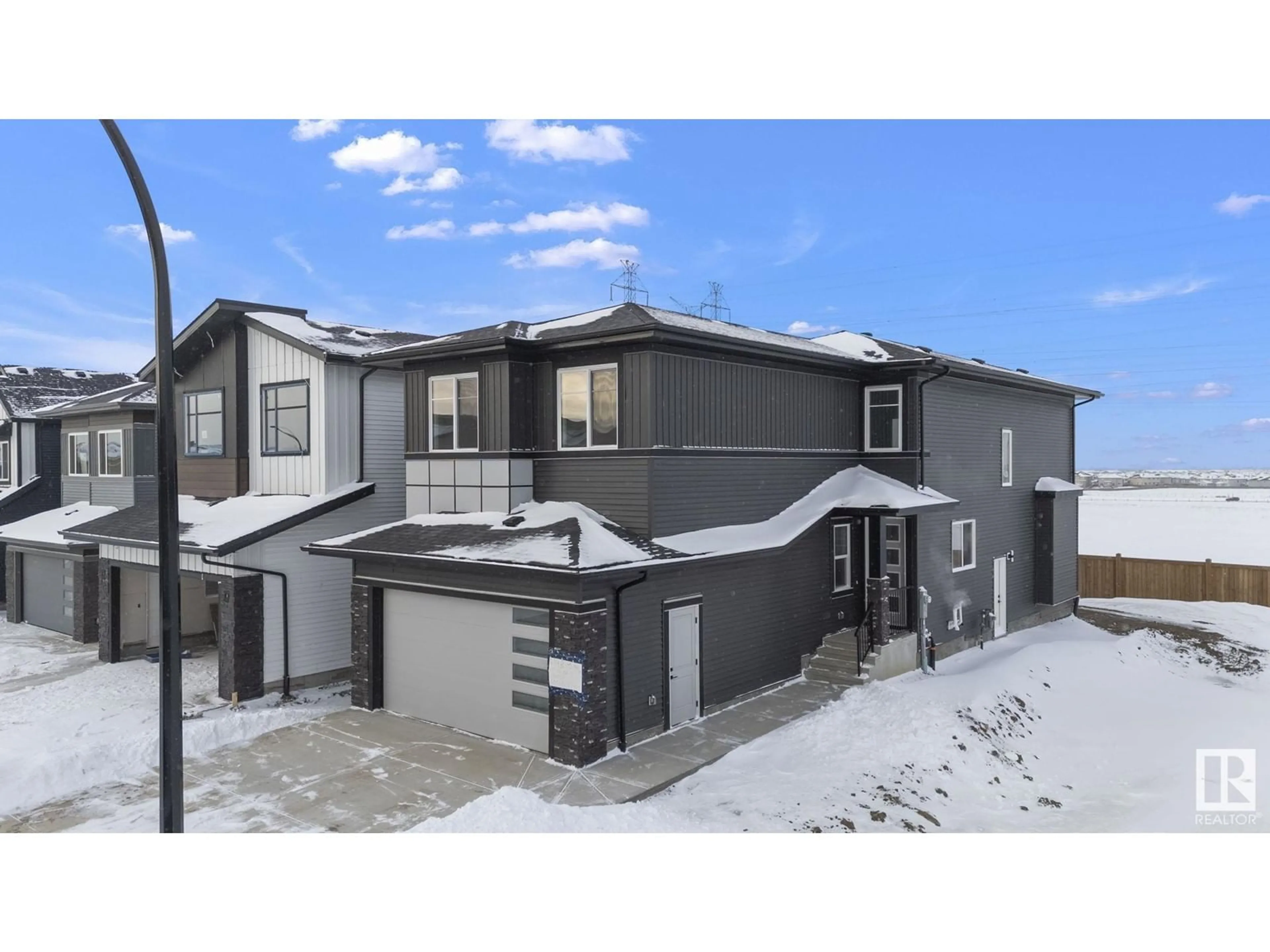 Home with vinyl exterior material, street for 2748 1 AV SW, Edmonton Alberta T6X3E4