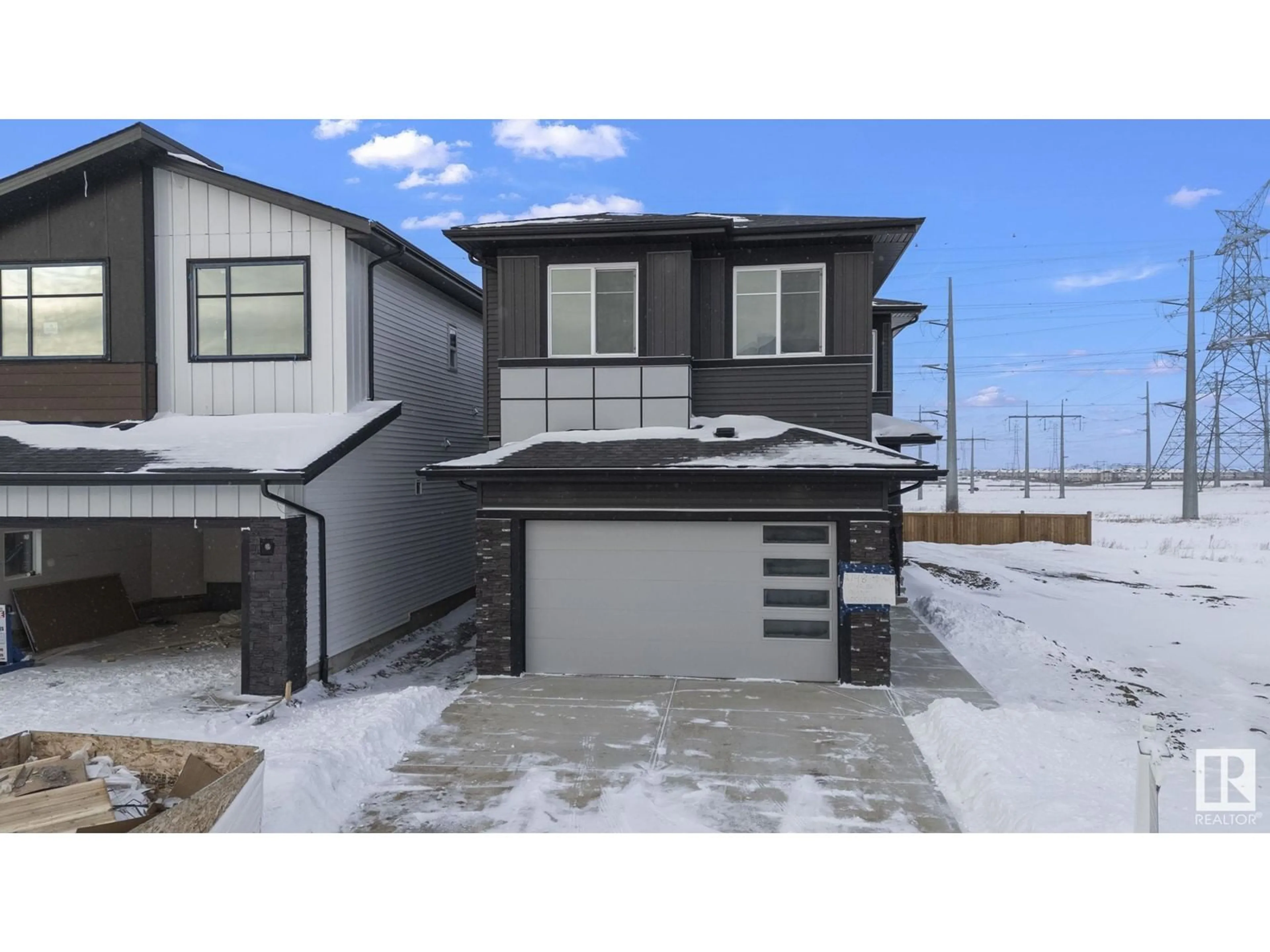 Home with vinyl exterior material, street for 2748 1 AV SW, Edmonton Alberta T6X3E4