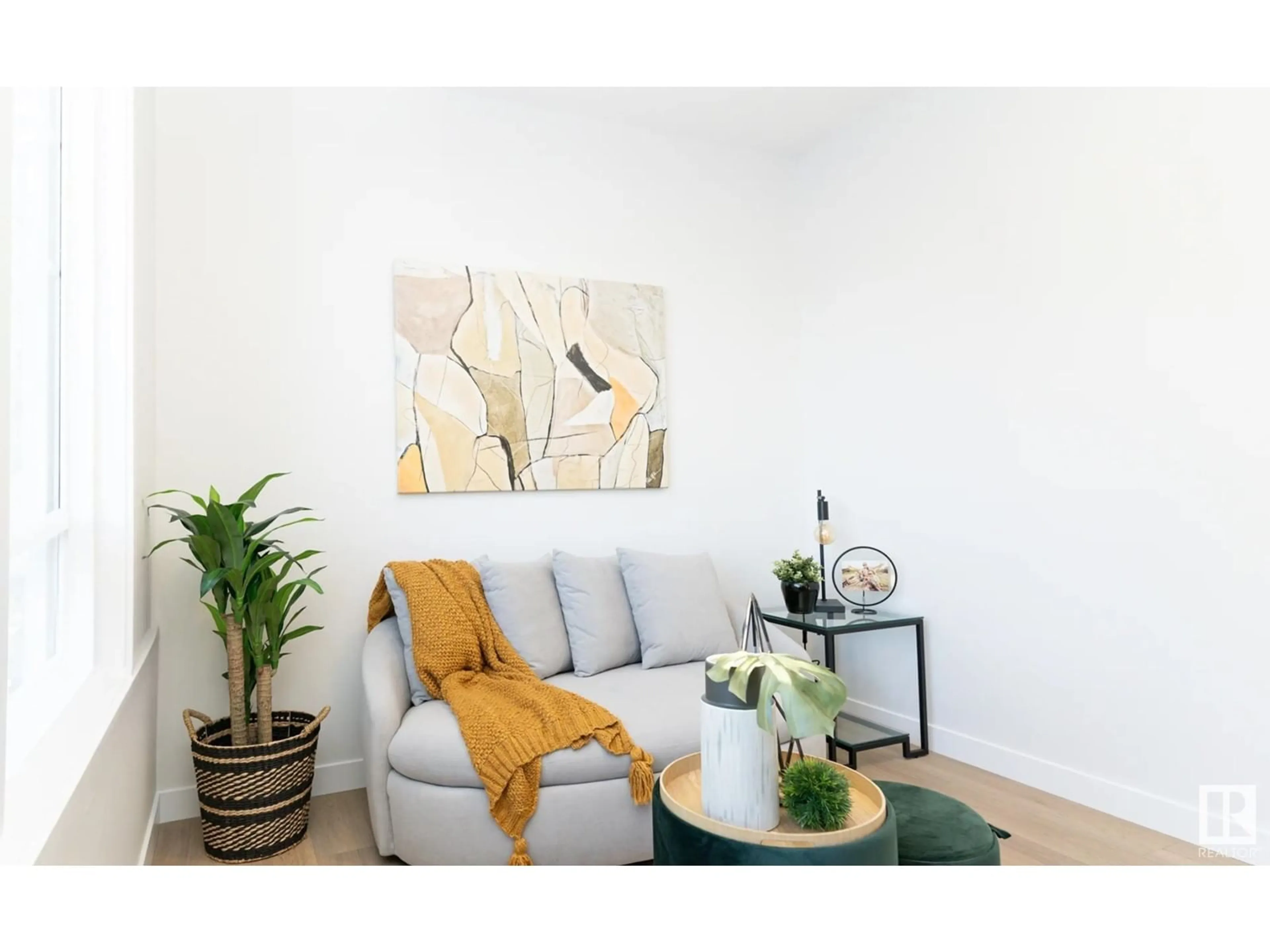 Living room with furniture, wood/laminate floor for 6106 CARR RD, Edmonton Alberta T5E6Y4
