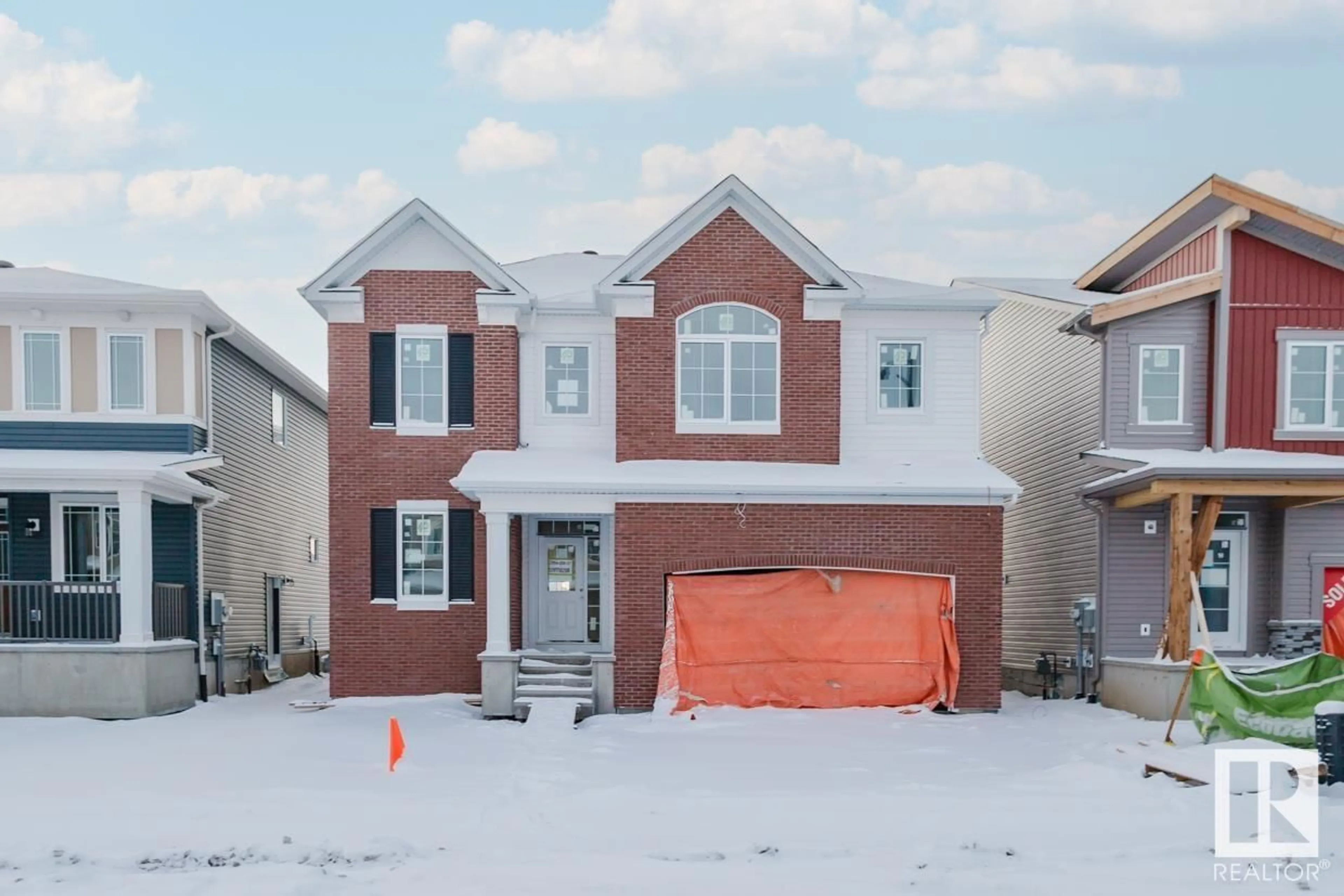 Home with brick exterior material, street for 2104 208 ST NW, Edmonton Alberta T6M2X6