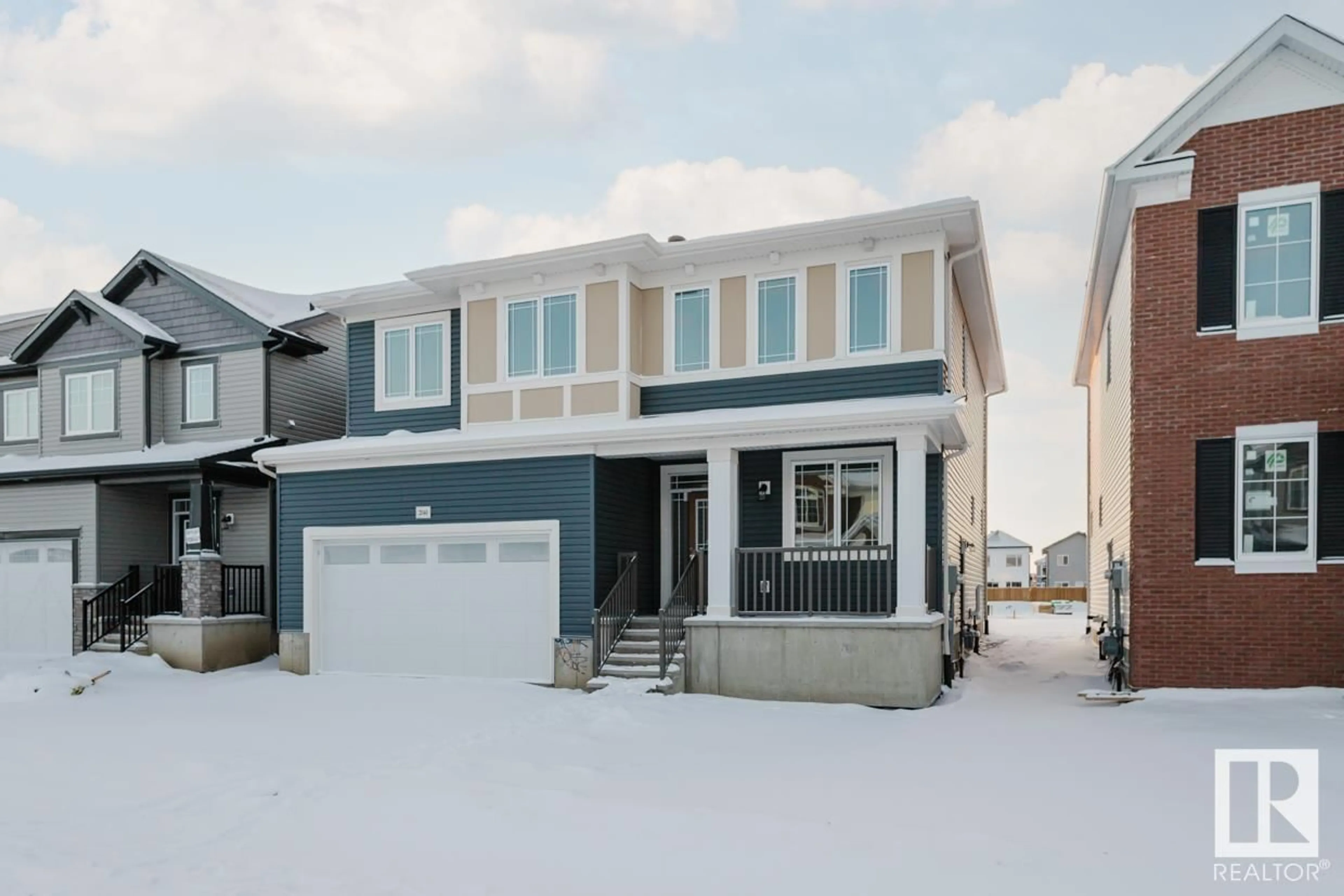 Home with vinyl exterior material, street for 2040 208 ST NW, Edmonton Alberta T6M2X6